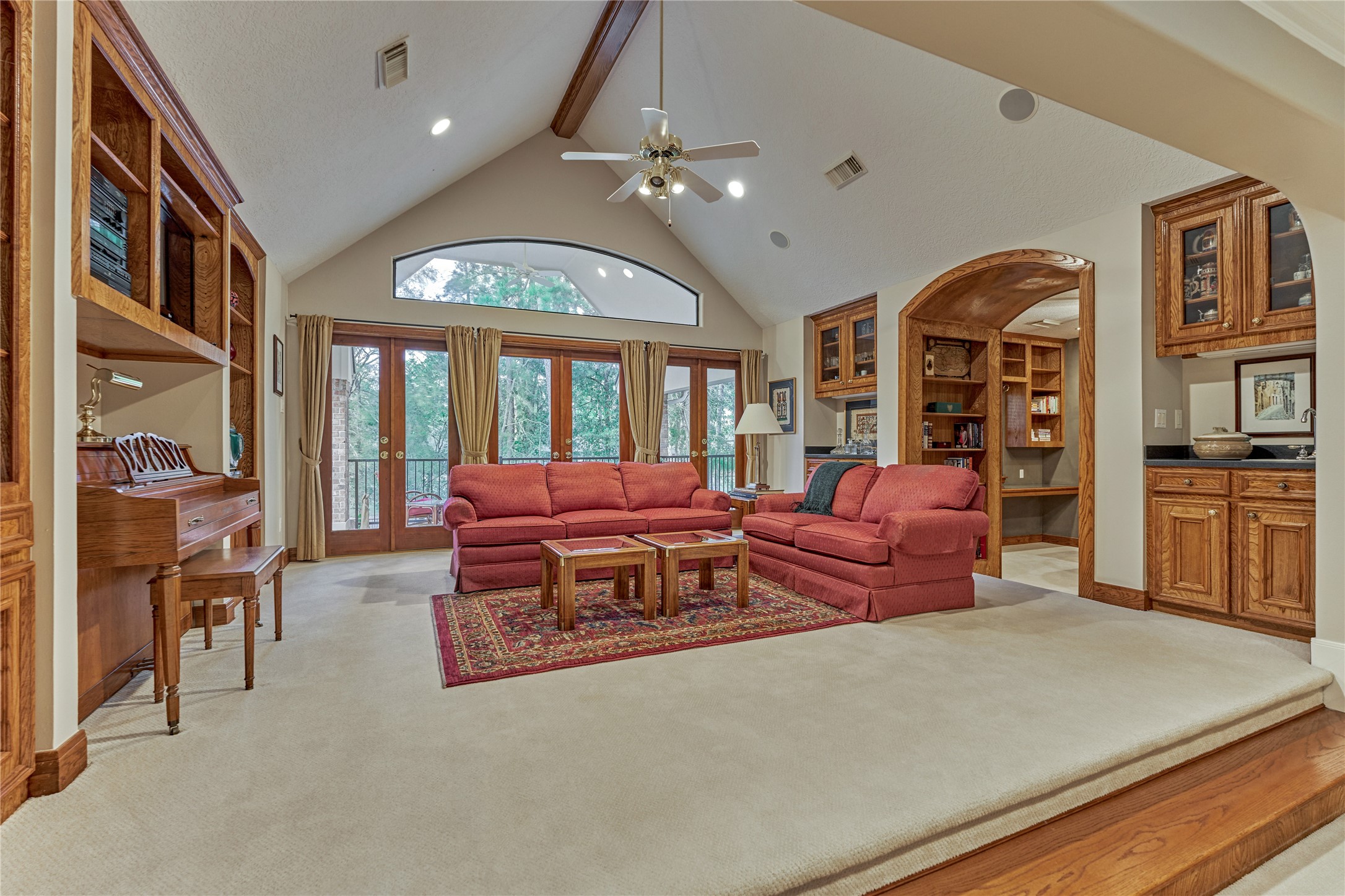 The game room boasts of a vaulted ceiling and a lighted wet bar w/sink. French doors open to the tranquil balcony that overlooks the remarkable pool and backyard.
