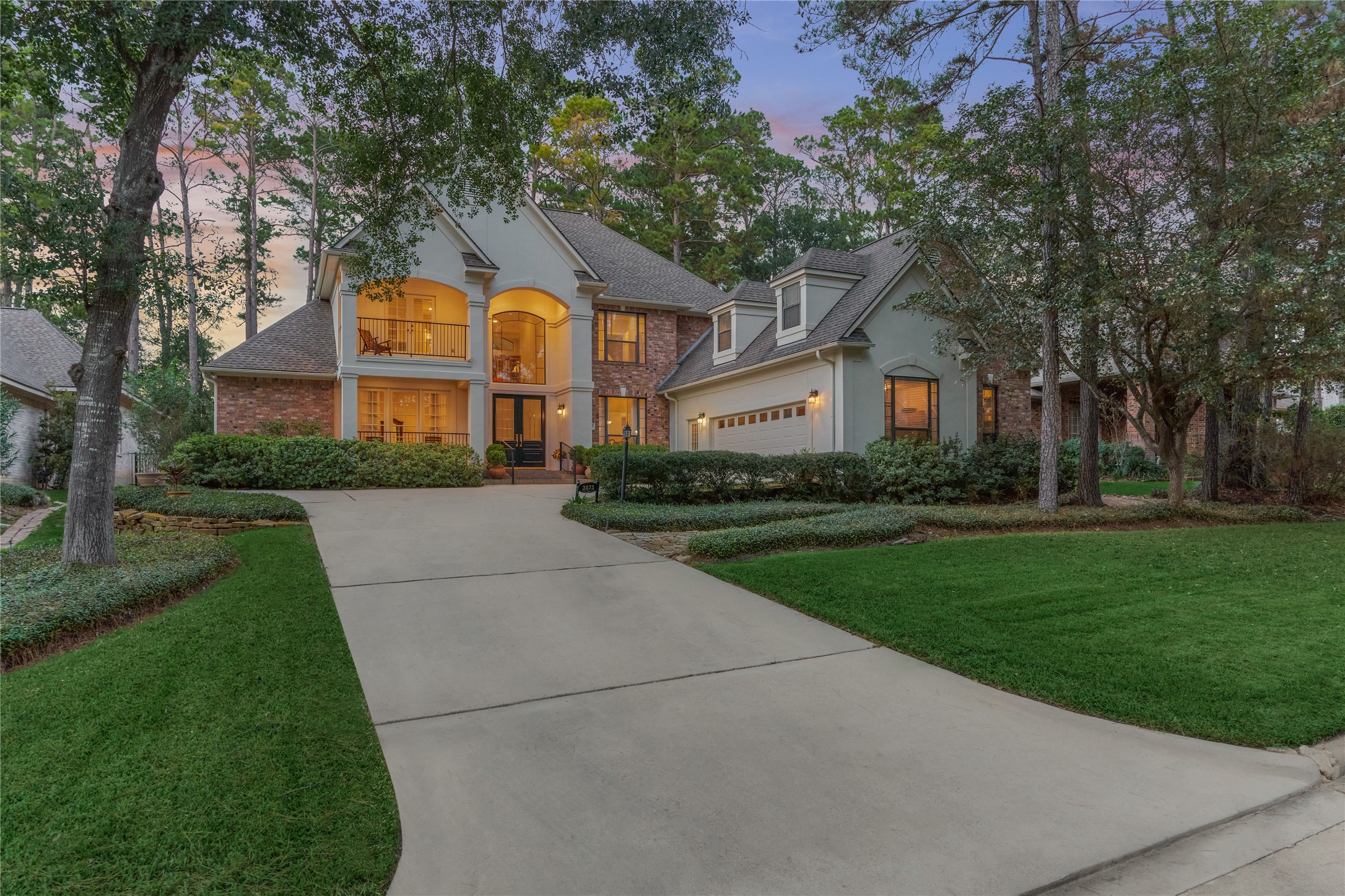 The elegant stucco and brick facade welcome you, with dormer windows above the 2-car garage adding a touch of classic charm. There is also a golf cart entry on the back of the garage.