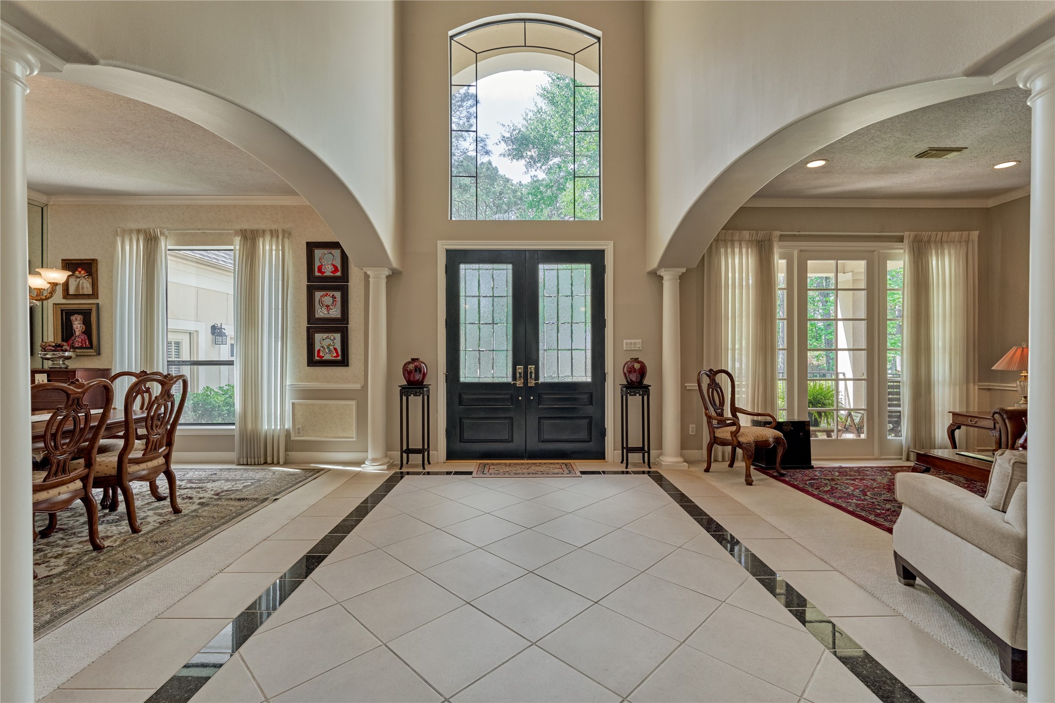 Soaring ceilings and abundant natural lighting provide an open and airy ambiance.