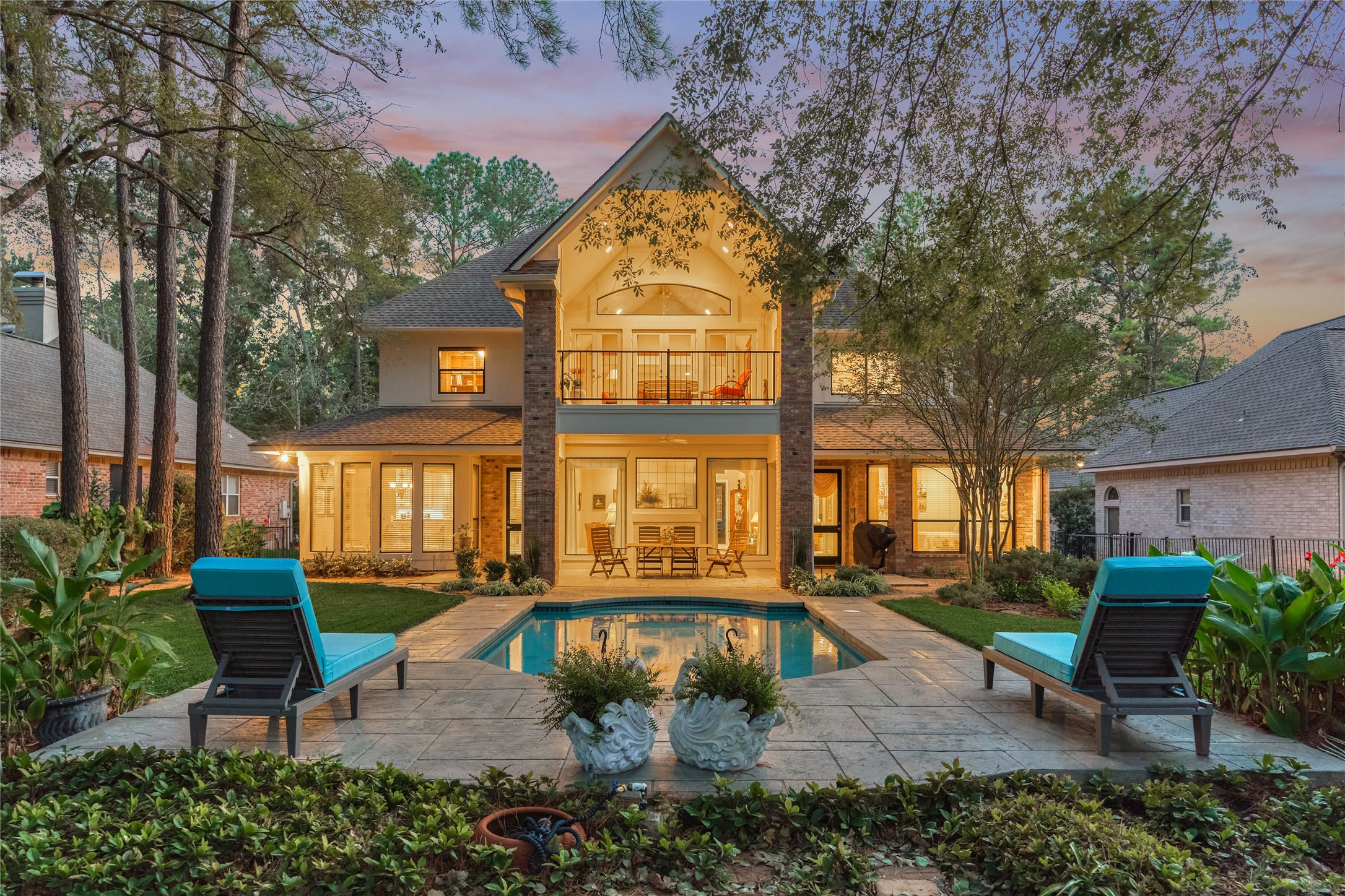 Beautiful landscaping surrounds the poolside oasis while majestic trees provide a private and shady backyard.