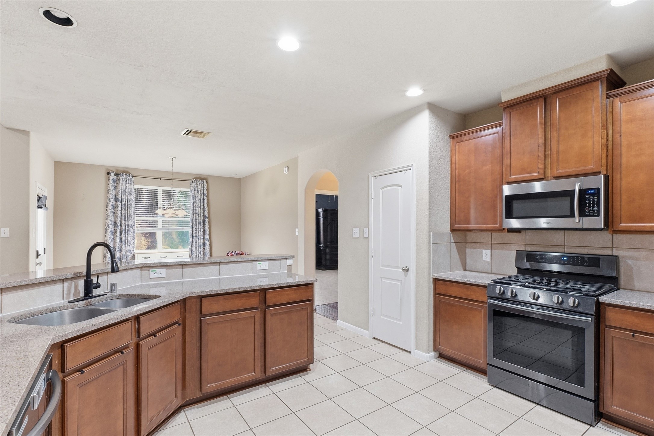 Large kitchen with lots of storage and stainless steel appliances