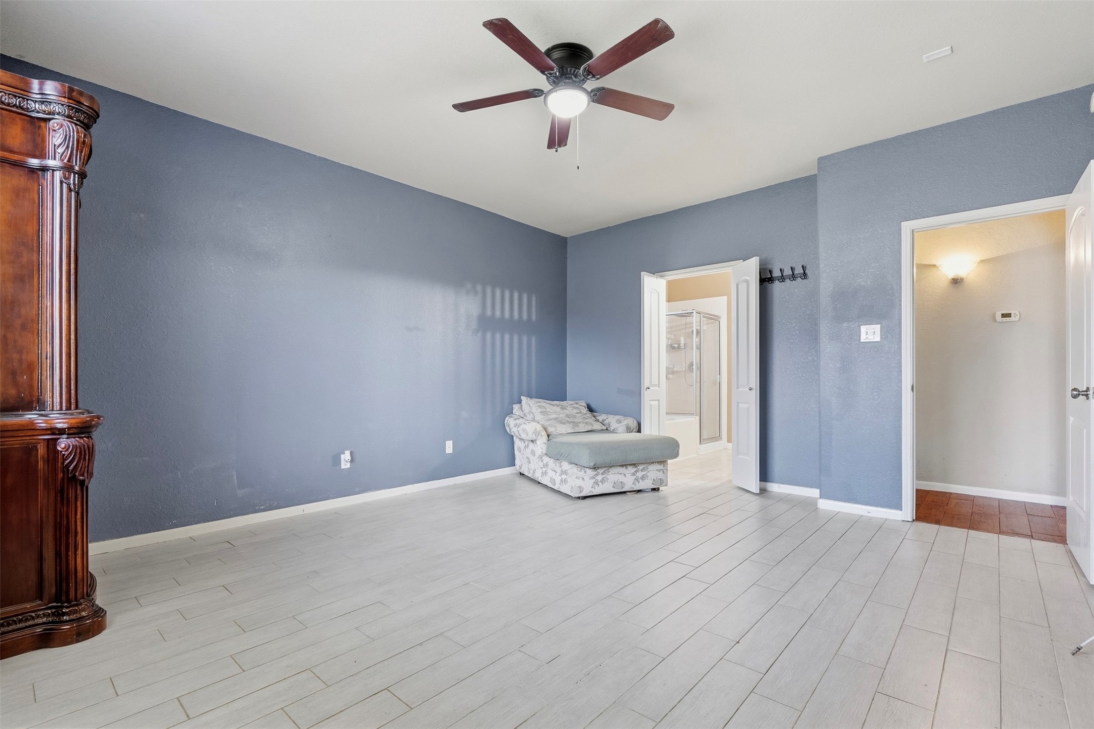 Another view of the primary bedroom