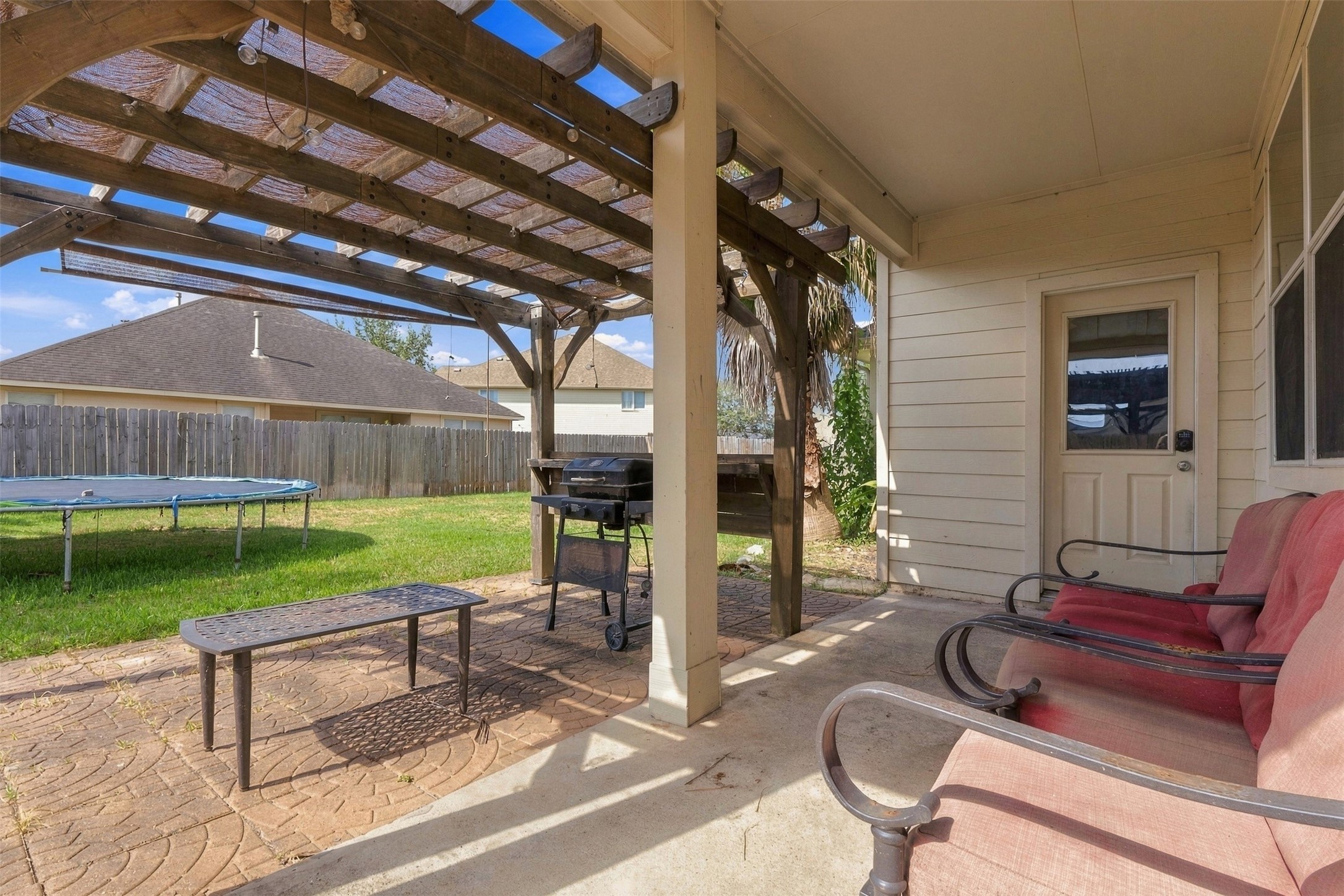 Backyard patio with pergola