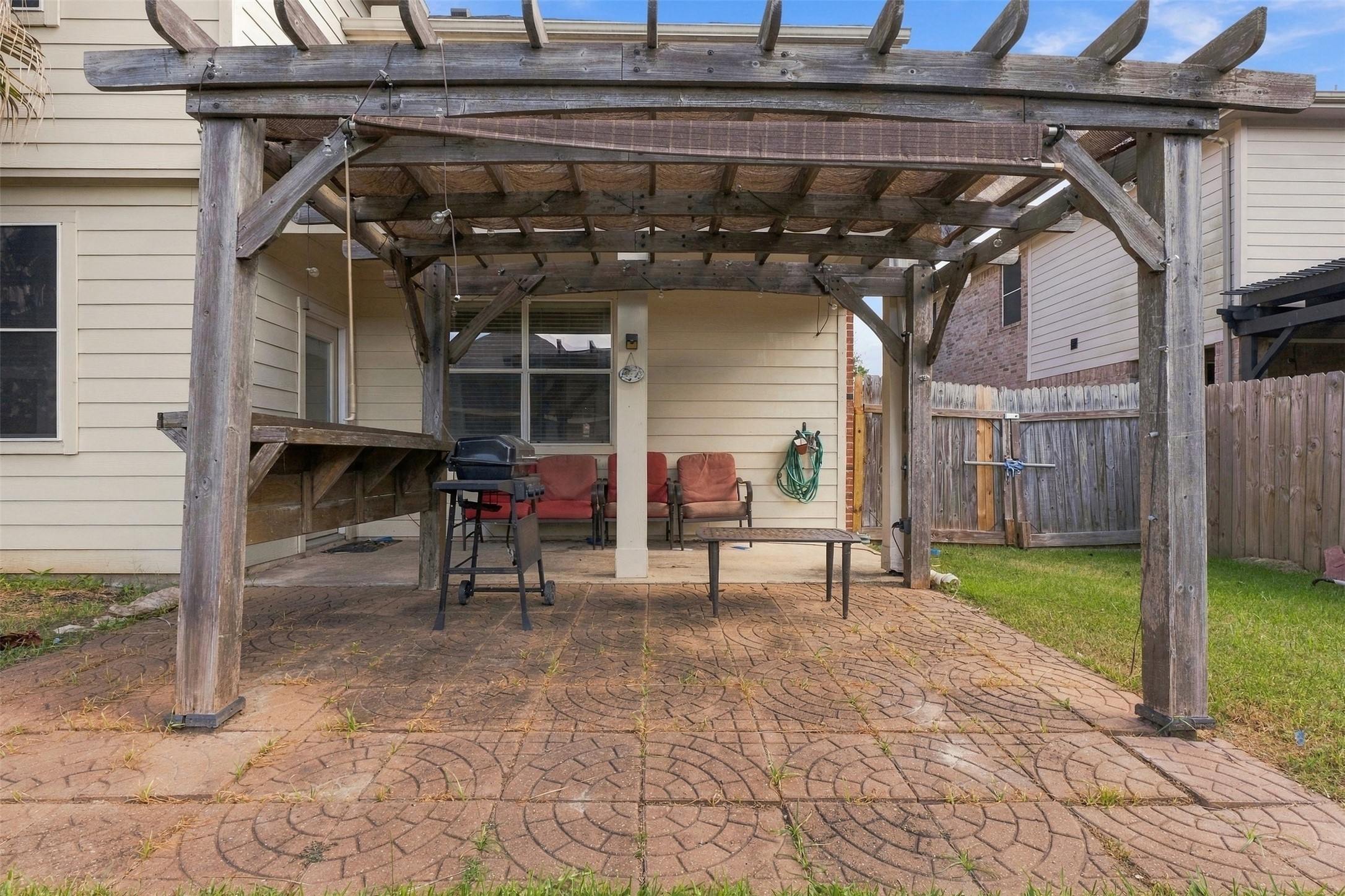 Another view of patio with pergola
