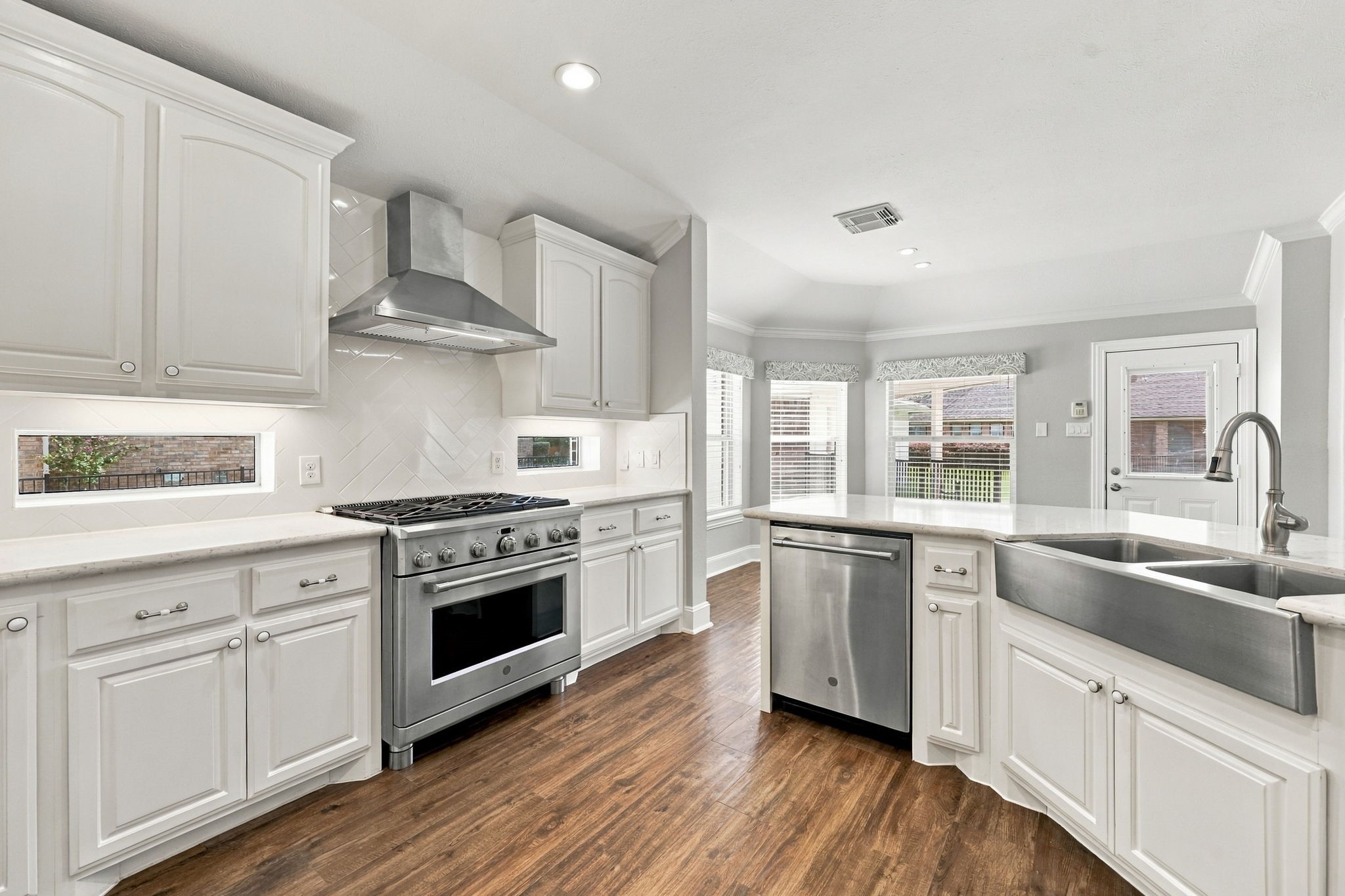 The Kitchen is a chefs dream, featuring a GE Caf stainless steel appliance package, gorgeous Quartz countertops, and crisp white soft-close cabinetry and drawers. The combination of stylish finishes and thoughtful design creates a beautiful and functional space for both everyday cooking and entertaining.