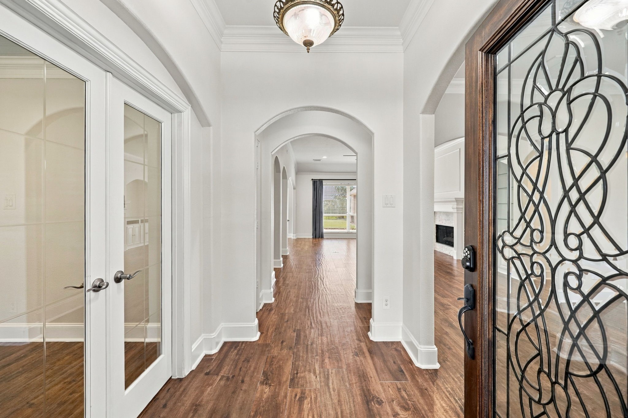 As you enter this gorgeous, beautifully updated home, you are welcomed by wood-look tile flooring throughout, fresh paint, 10-foot ceilings, elegant architectural arches, and breathtaking views that stretch as far as the eye can see. Double glass doors to the left lead to the private Home Office, offering a quiet and inviting space for work or study.