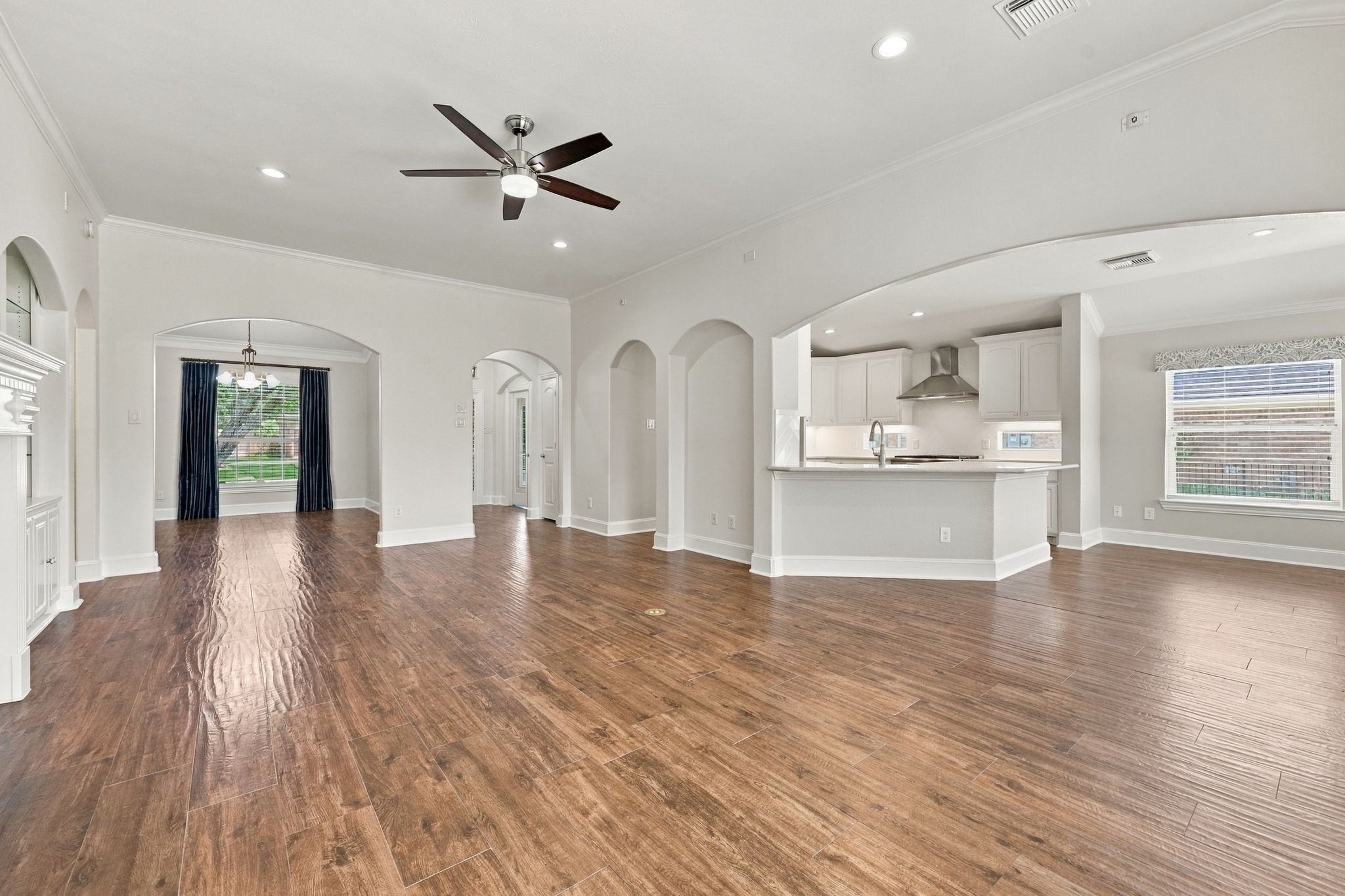 This view from the Family Room looks toward the Kitchen and Breakfast area and showcases the impressive size and scale of the room. No detail has been overlooked, including the convenient floor outlet, perfect for lamps and other electronics without the need for visible cords.