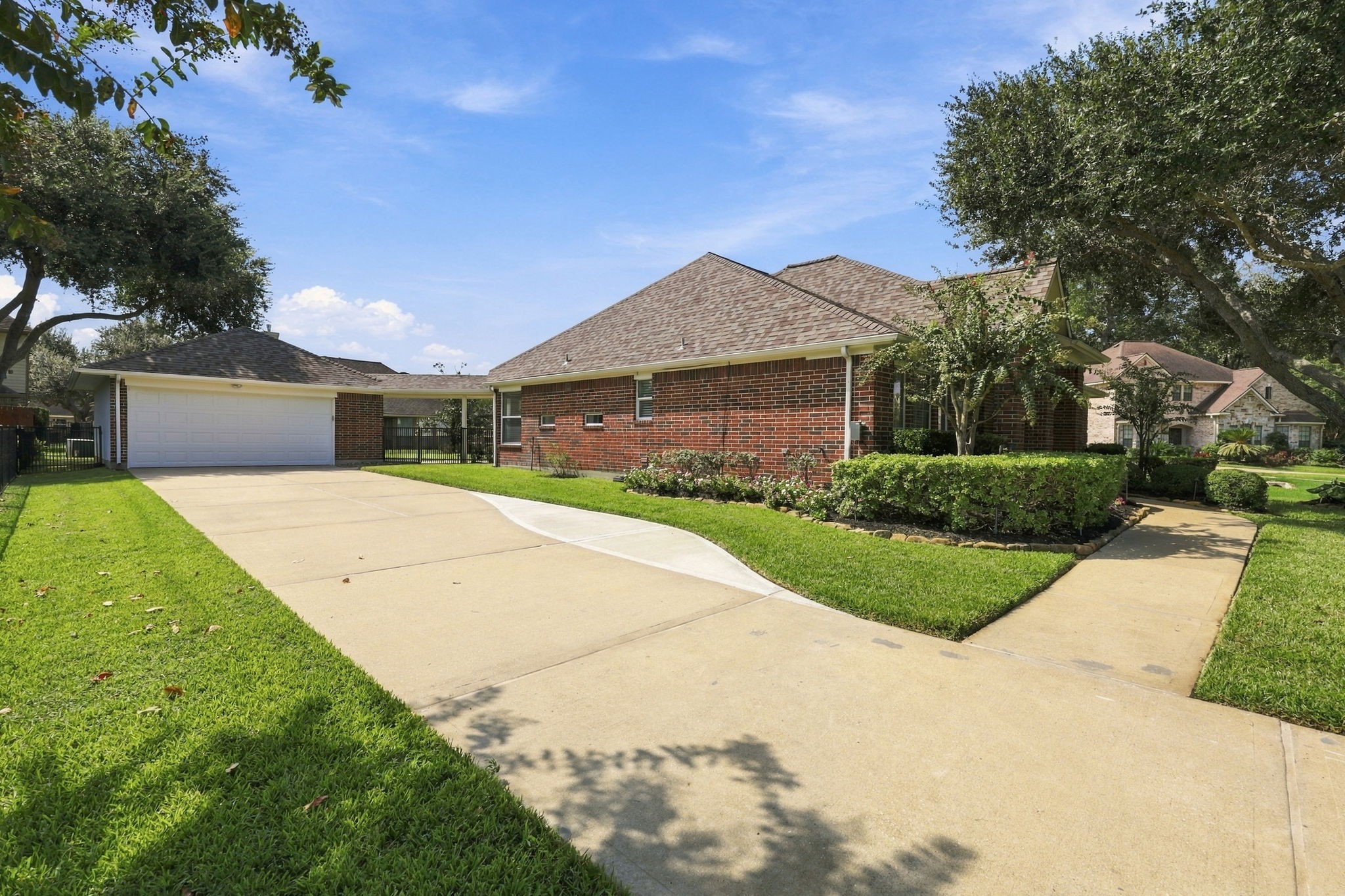 The long driveway leads to an Oversized Detached Garage and offers plenty of parking for family and guests, providing both convenience and ample space.