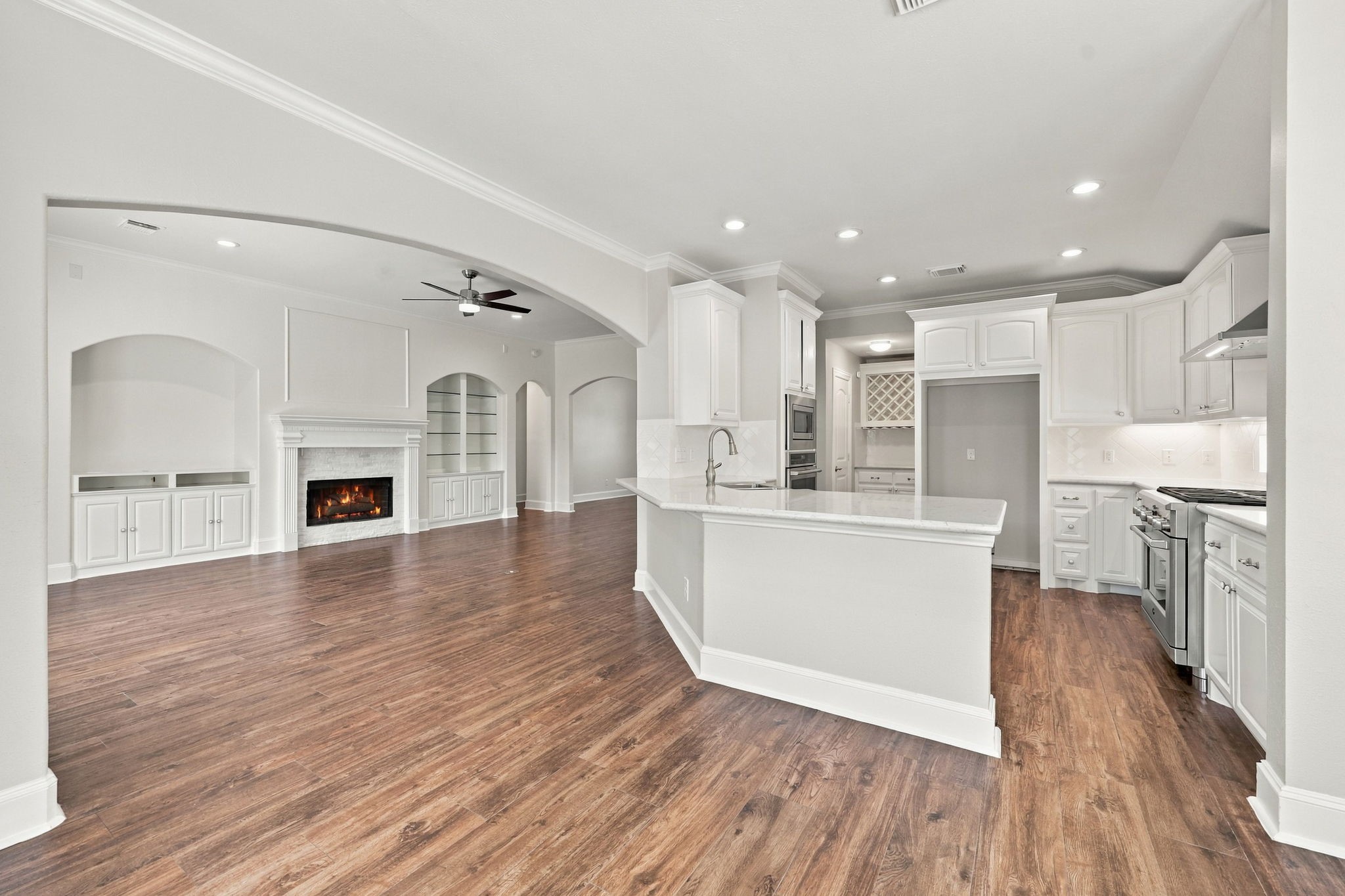 Looking from the Breakfast Area toward the Kitchen and Family Room, this view highlights the seamless flow between the spaces and the open-concept design, making it easy to enjoy everyday living and entertaining.