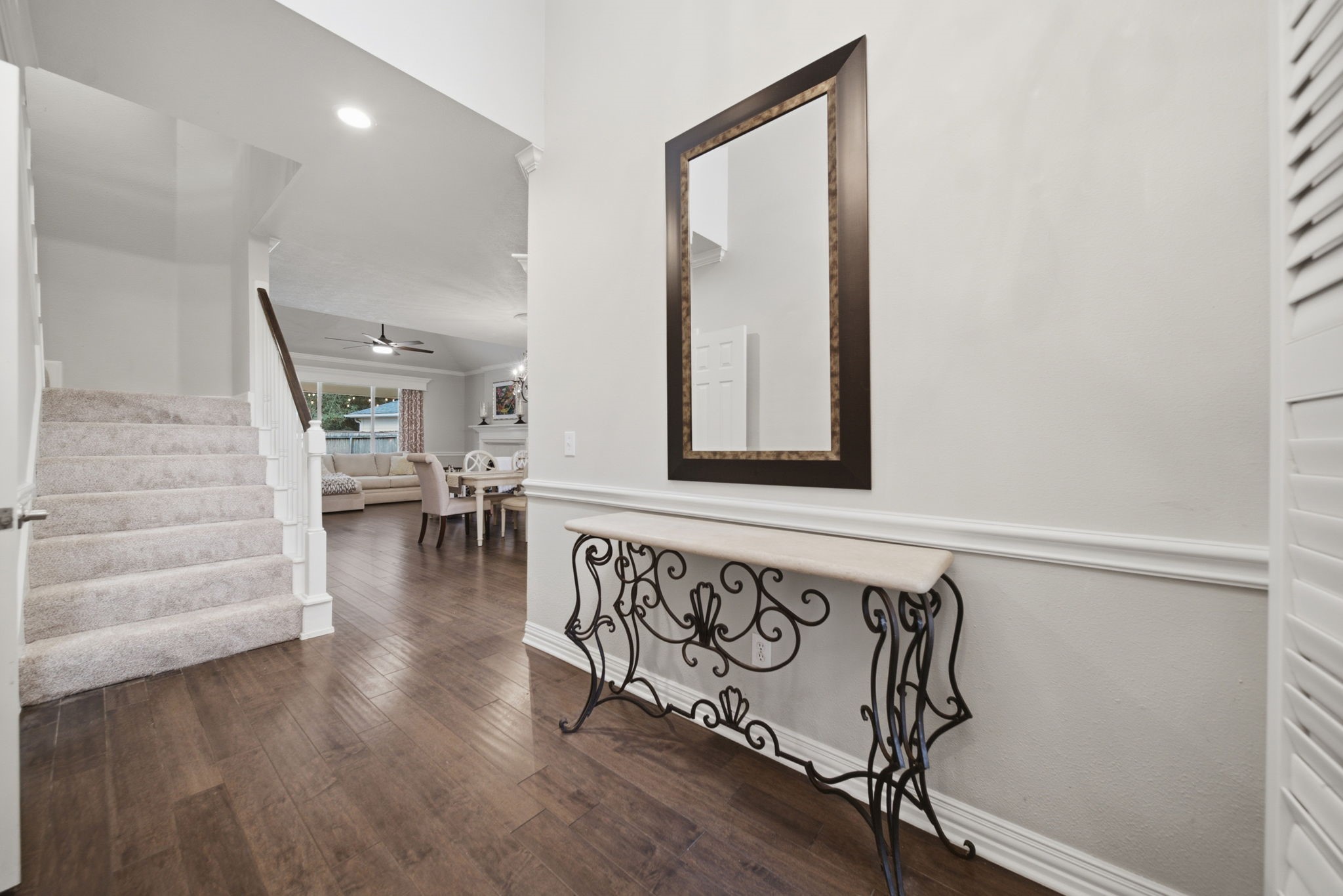 This entry welcomes you inside. Check out the warm wood flooring in the living areas. The carpeting was just replaced in October 2026.