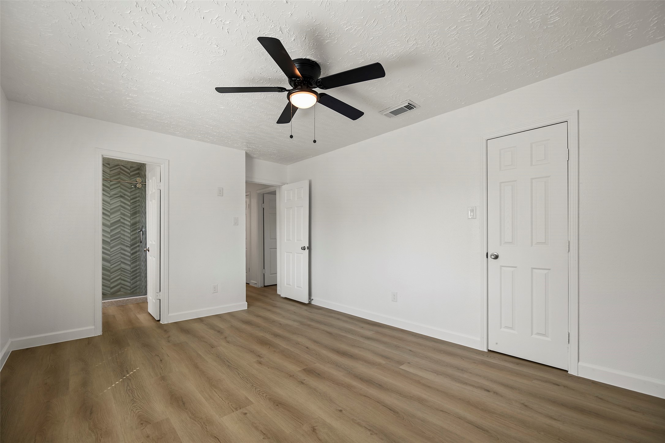 Another angle with access to the primary bathroom