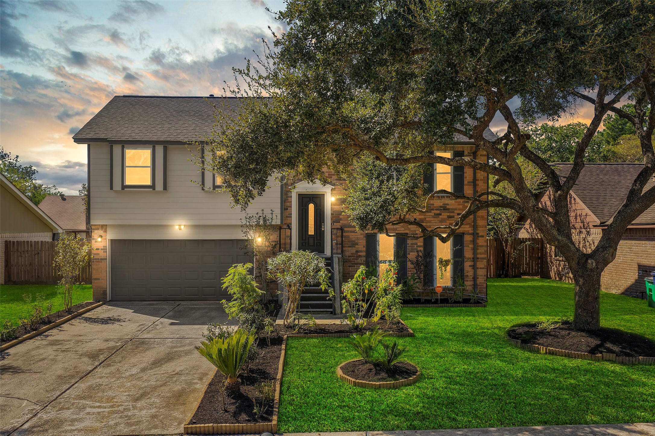 Beautiful two-story home with mature landscaping and inviting curb appeal