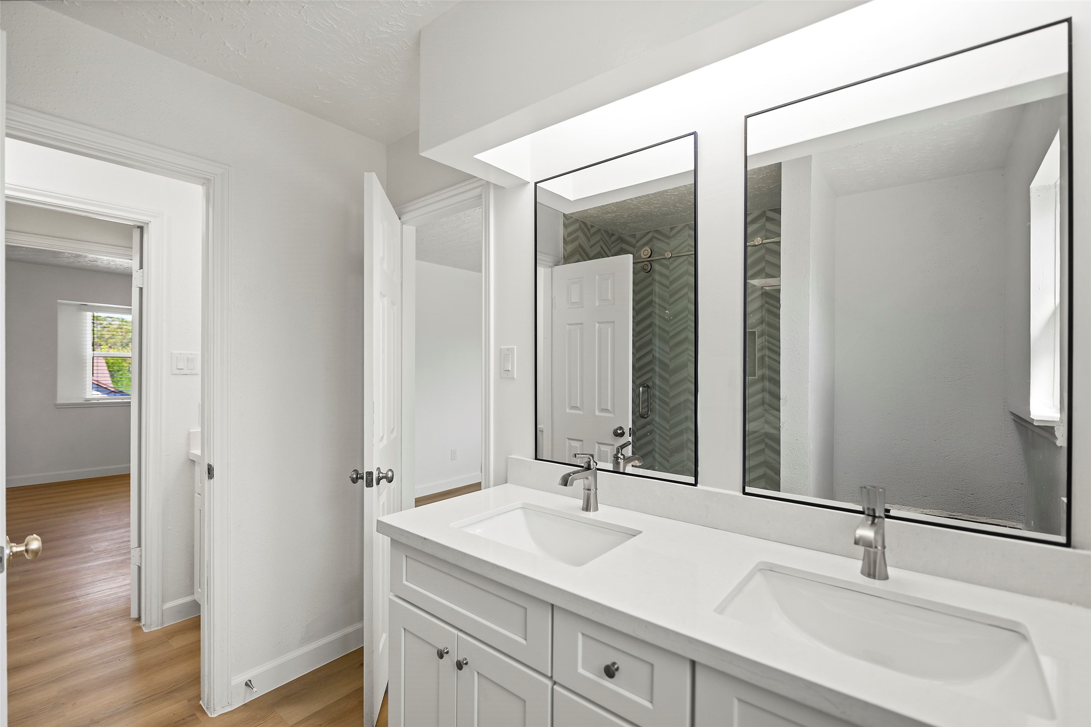 Beautifully updated with dual vanities and modern finishes.