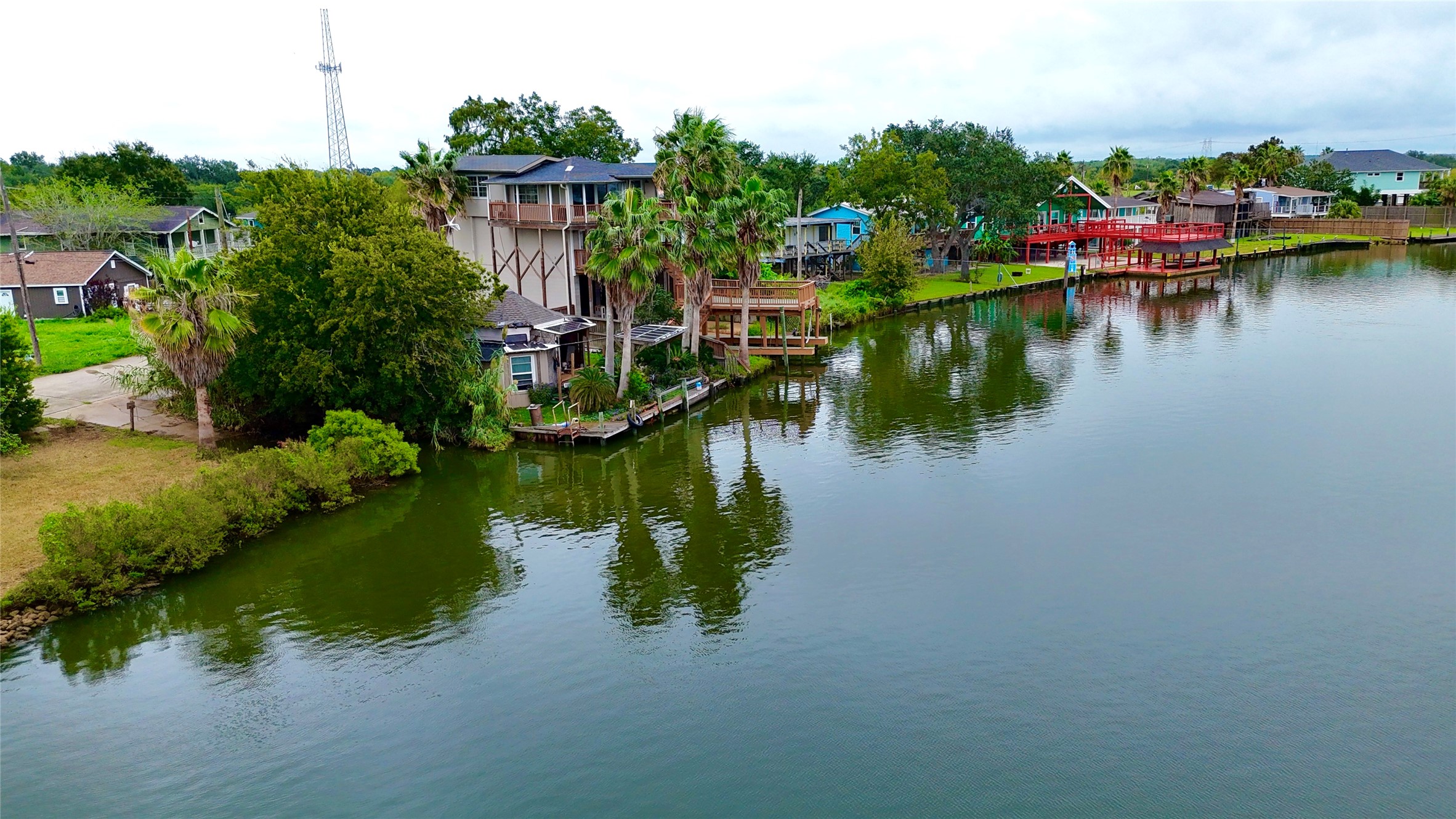 Aerial view showcasing the waterfront setting, canal views, and surrounding waterfront residences. Aerial view showcasing the waterfront setting, canal views, and surrounding waterfront residences.