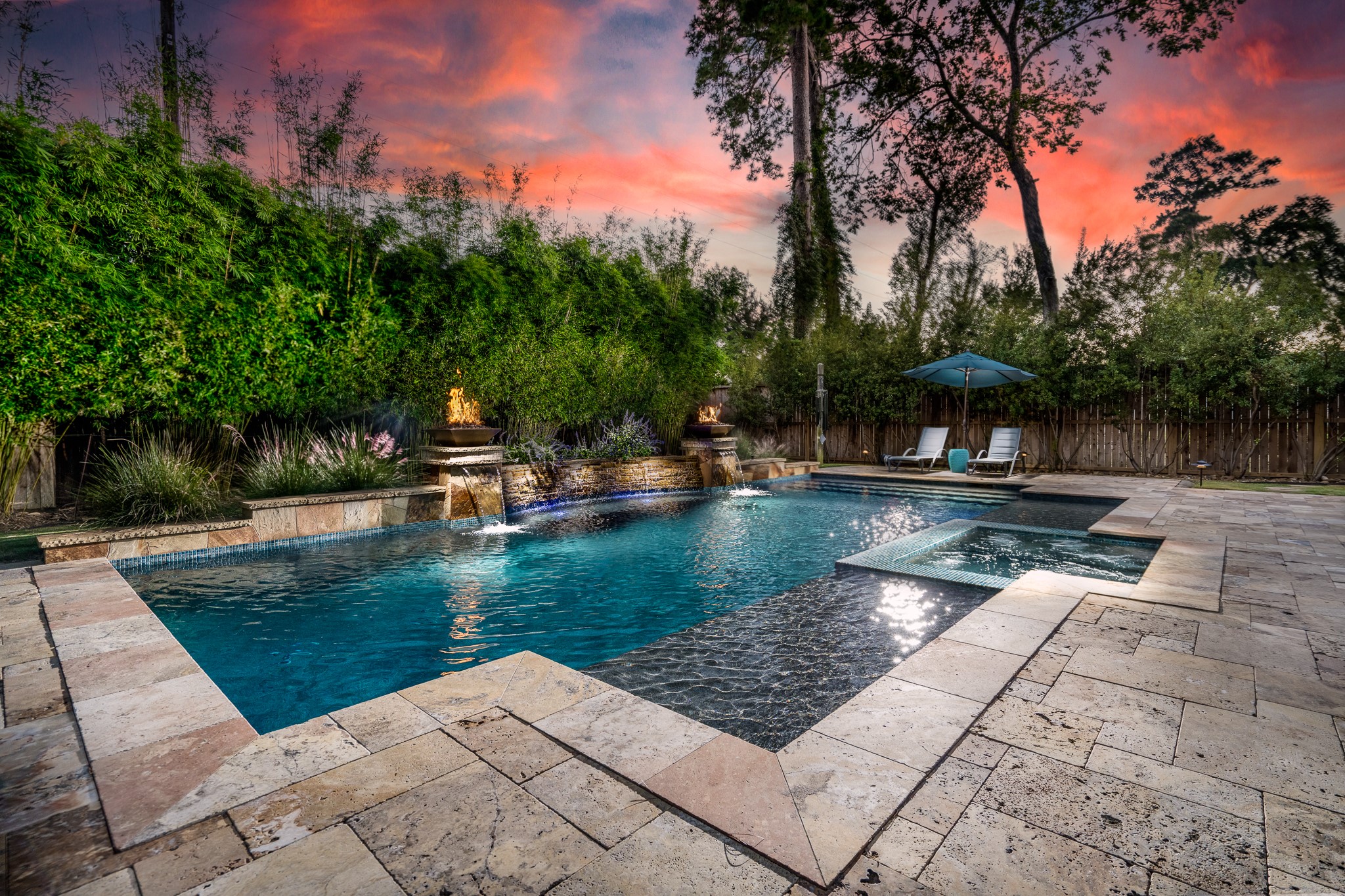 WHEN THE SUN GOES DOWN, THE MAGIC BEGINS! ??? Imagine ending every day in your own private resort-style paradise! Cascading waterfalls, mesmerizing fire features, a sparkling pool and inviting spa create an unforgettable outdoor escape. Surrounded by lush tropical-inspired landscaping and breathtaking skies, this extraordinary backyard oasis is where luxury living meets everyday vacation vibes! ????