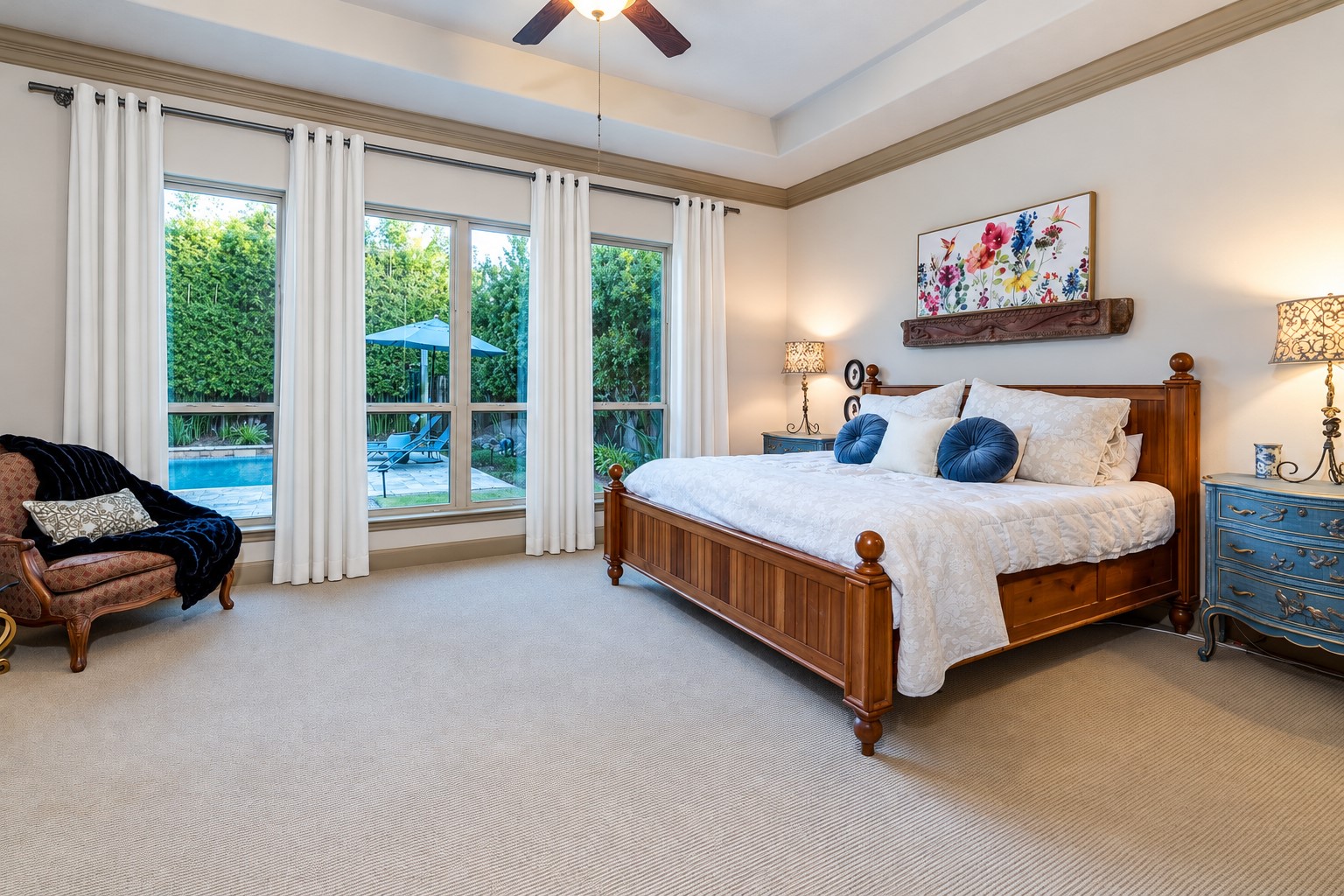 Your Private Sanctuary Awaits! Escape to this luxurious owner's retreat, where soaring ceilings, abundant natural light, and picturesque views of the sparkling backyard pool create an atmosphere of serenity and sophistication. Unwind in the spa-inspired ensuite bath, your personal haven for relaxation and rejuvenation. A beautiful blend of elegance, comfort, and tranquility!