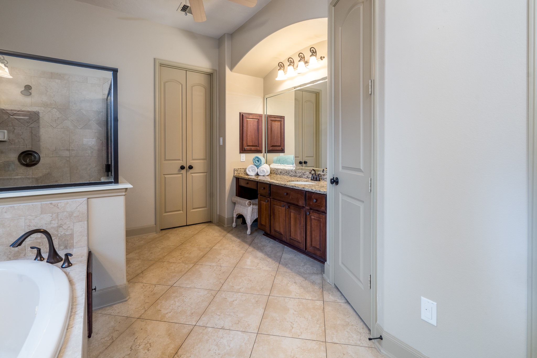 A LITTLE LUXURY, A LOT OF SERENITY! Imagine beginning your mornings feeling refreshed and ending your evenings in complete relaxation. This beautifully appointed primary ensuite offers the perfect escape, featuring elegant granite vanities, a spacious glass-enclosed shower, a luxurious soaking tub, and timeless natural stone finishes. Thoughtfully designed for comfort and indulgence, this spa-inspired retreat transforms everyday routines into moments of pure relaxation!