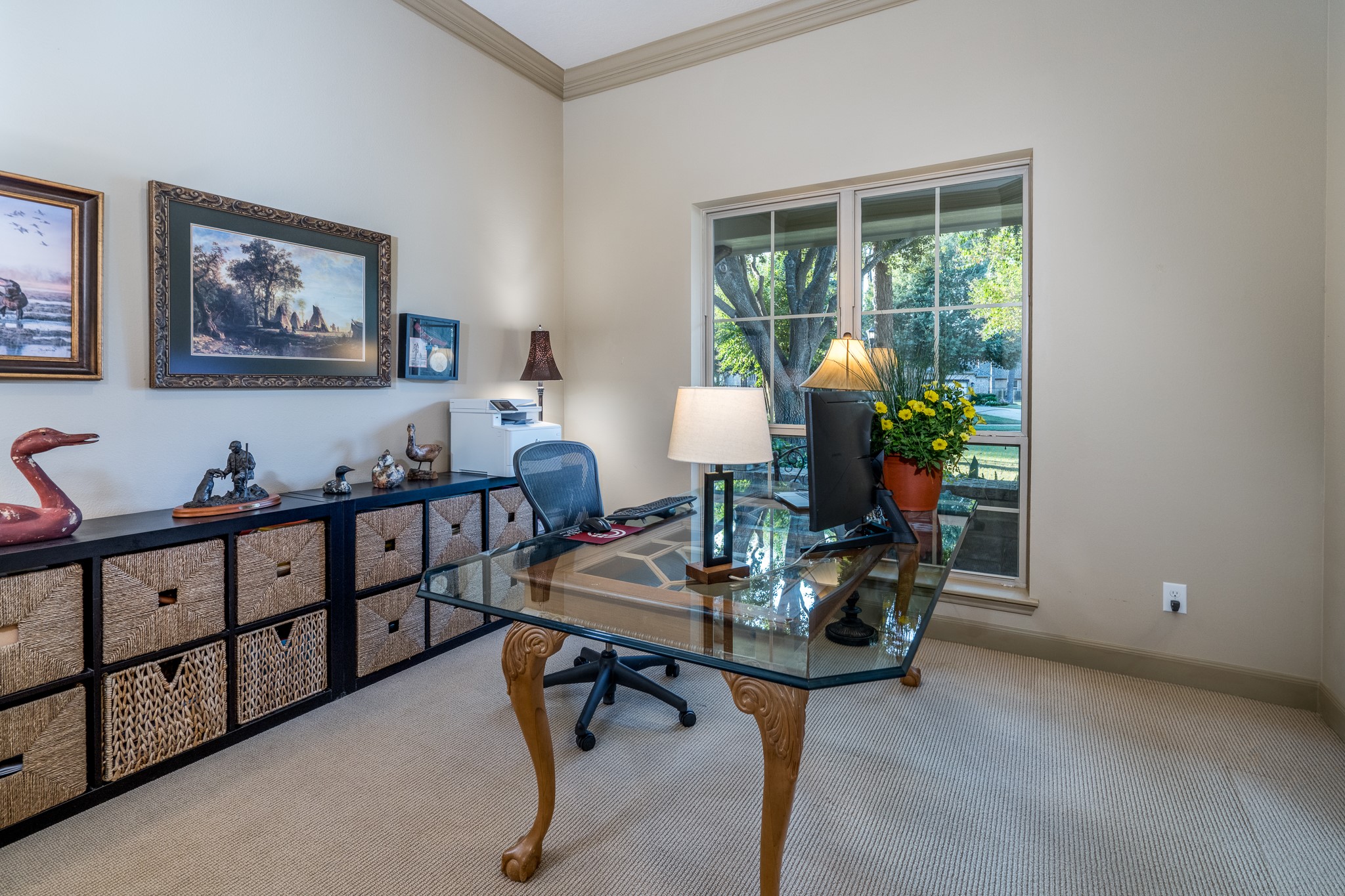 WHERE INSPIRATION MEETS SOPHISTICATION! This beautifully appointed private study offers an inviting retreat for working from home, reading, or quiet reflection. Featuring elegant architectural details, generous natural light, and picturesque views of the lush landscaping, this versatile space perfectly balances productivity, comfort, and timeless style!