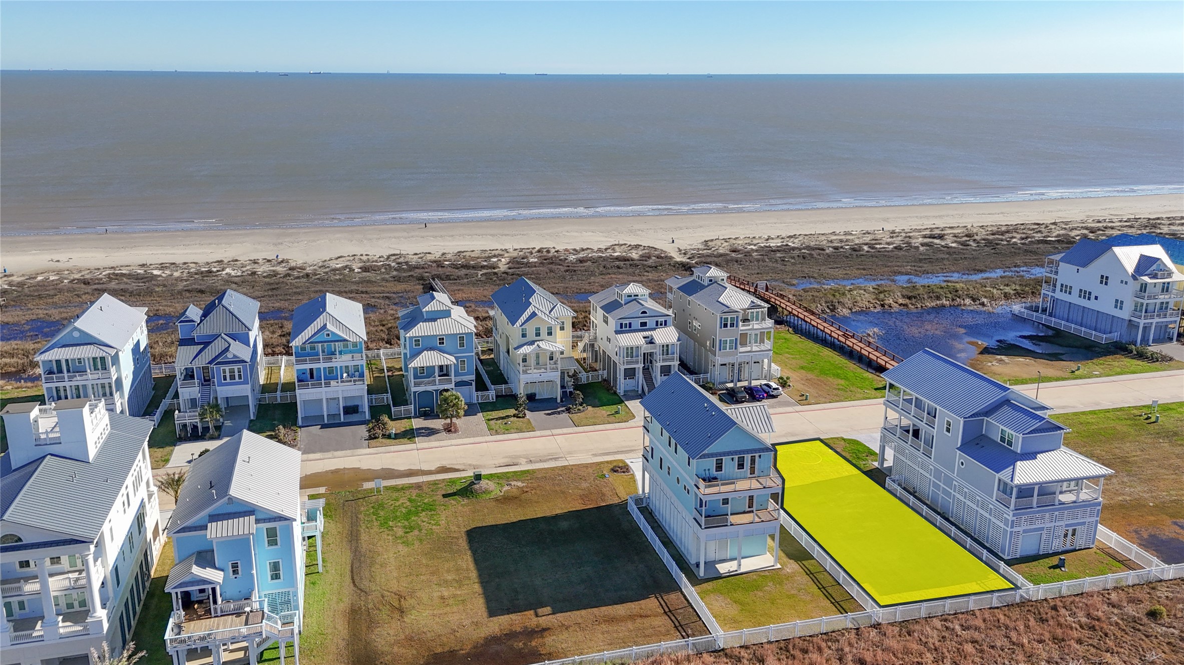 This elevated perspective illustrates just how close the homesite is to the shoreline, with only the neighboring row of residences separating the property from the Gulf of Mexico. The lots location within the gated Preserve at Grand Beach offers the opportunity to design around sunrise views toward the Gulf while enjoying the privacy and more intimate atmosphere of this secluded East End community. This elevated perspective illustrates just how close the homesite is to the shoreline, with only the neighboring row of residences separating the property from the Gulf of Mexico. The lots location within the gated Preserve at Grand Beach offers the opportunity to design around sunrise views toward the Gulf while enjoying the privacy and more intimate atmosphere of this secluded East End community.