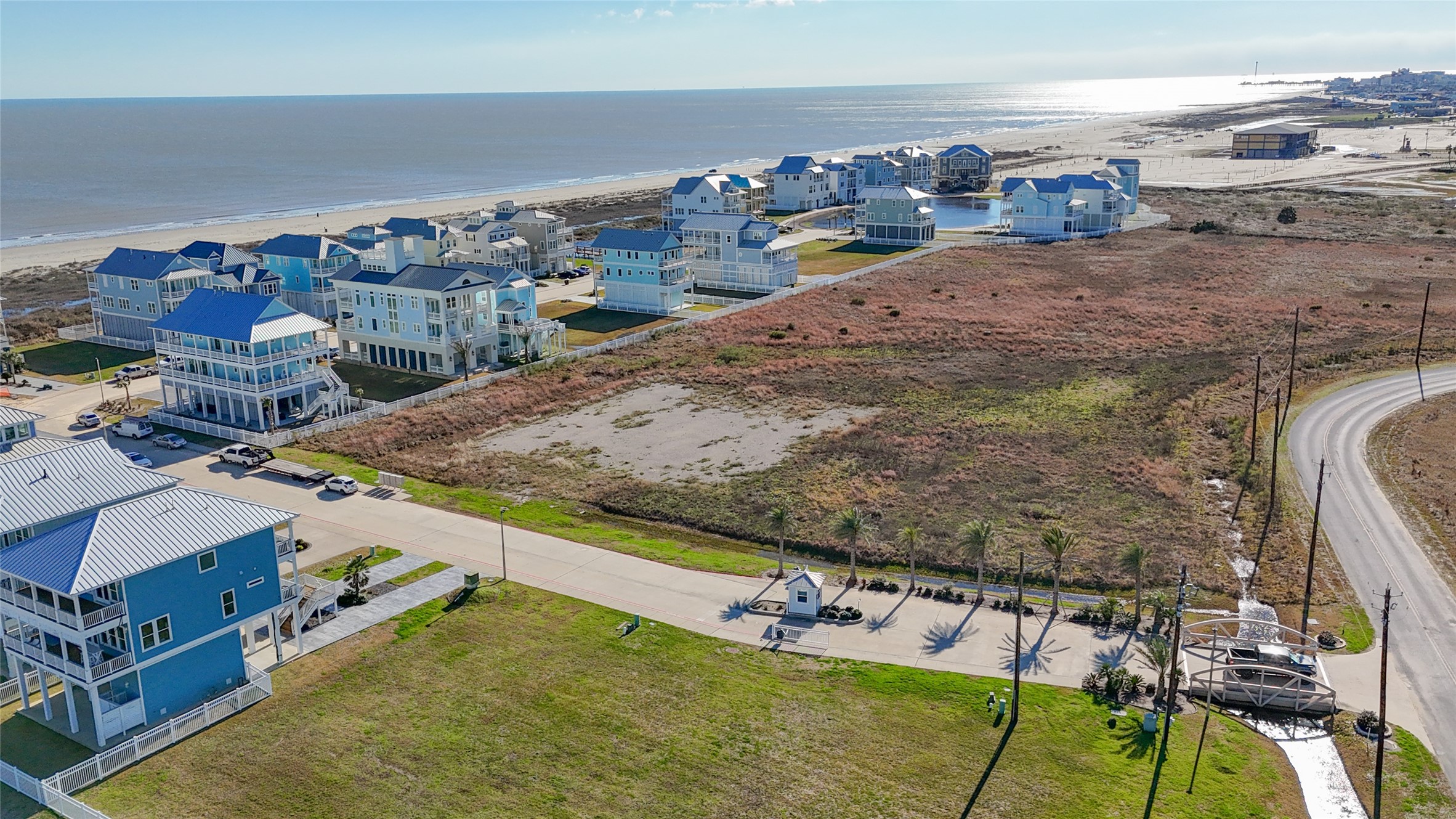 A wider aerial perspective showcases the low-density surroundings beyond the homesite and helps illustrate the property's open western exposure. The absence of an immediate rear residence provides breathing room rarely associated with an in-town Galveston building site and creates an appealing backdrop for rear-facing balconies, outdoor living spaces and windows designed to take advantage of evening light and expansive sunset views. A wider aerial perspective showcases the low-density surroundings beyond the homesite and helps illustrate the property's open western exposure. The absence of an immediate rear residence provides breathing room rarely associated with an in-town Galveston building site and creates an appealing backdrop for rear-facing balconies, outdoor living spaces and windows designed to take advantage of evening light and expansive sunset views.