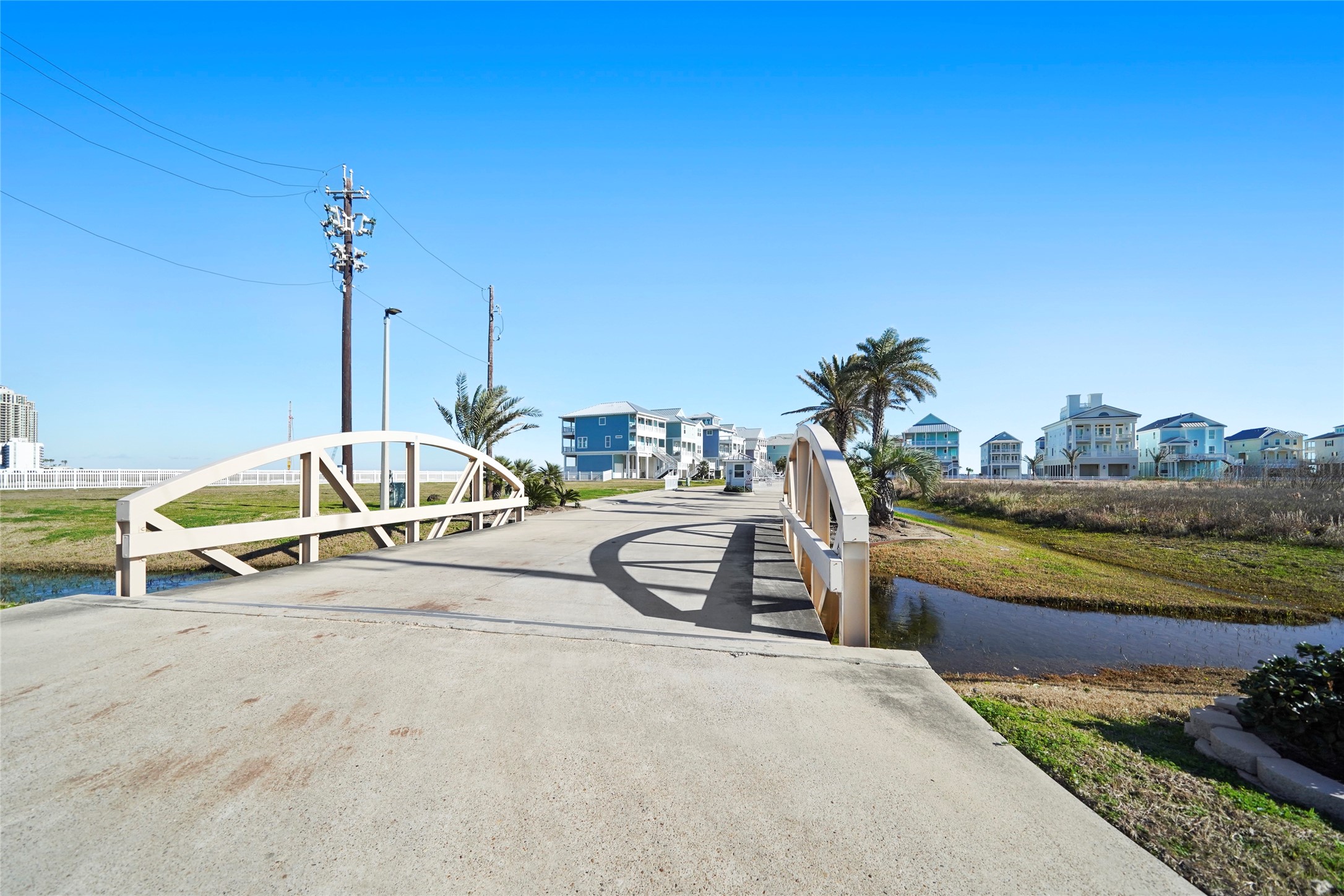The entrance to The Preserve at Grand Beach reinforces the private character of this secluded East End community. A controlled automatic gate marks the transition into a neighborhood of substantial coastal residences nestled next to the Gulf. From here, residents enjoy dedicated beach-walkover access while remaining only minutes from The Strand and Galvestons historic districts, dining, entertainment and other island destinations.
