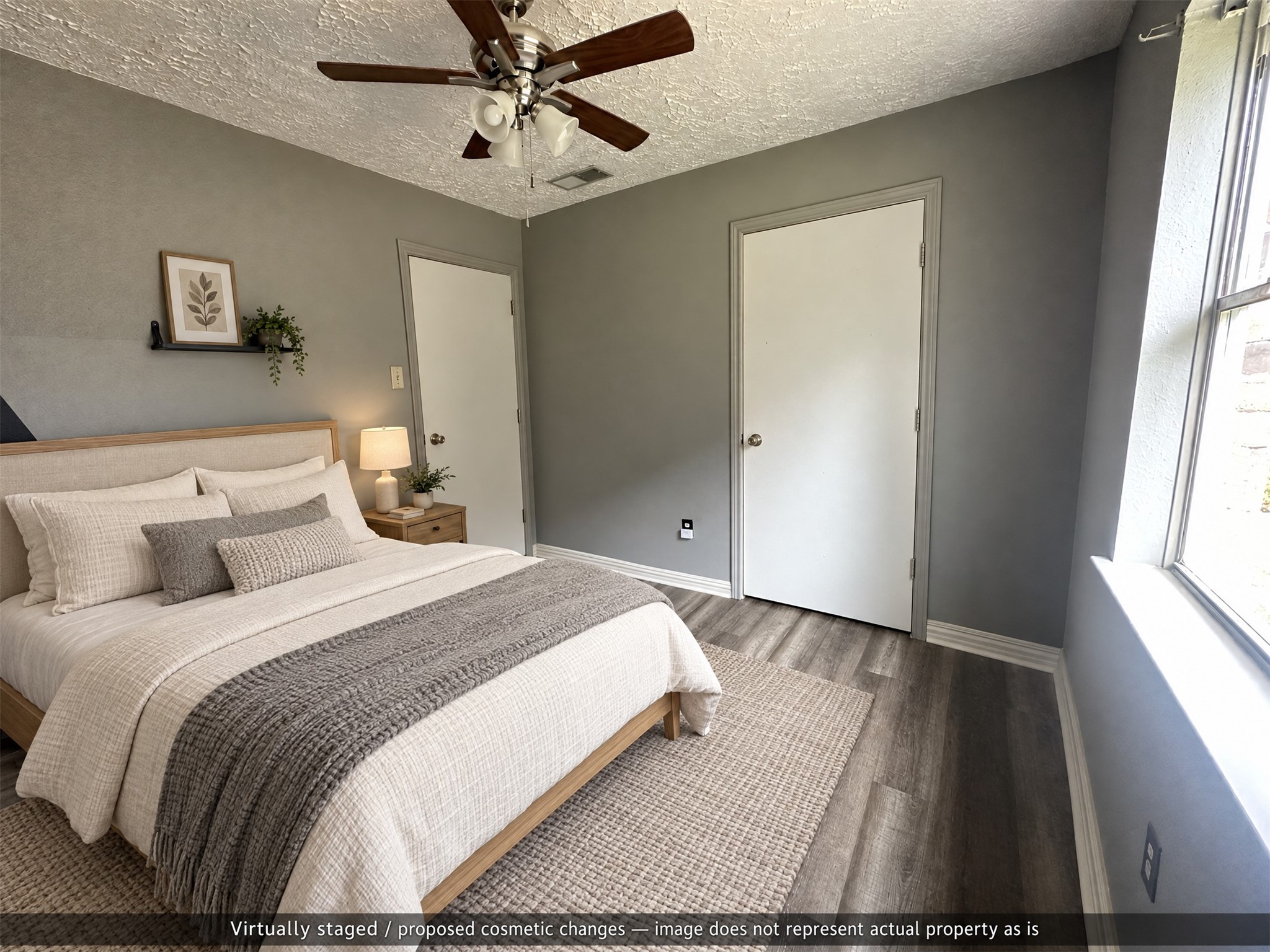 Virtually staged. Light neutral furnishings show the bedroom's scale while keeping closet and hallway access clear.