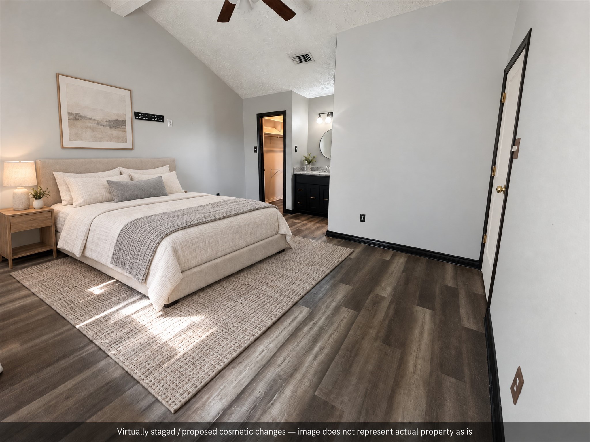 Virtually staged. A calm bedroom arrangement leaves the attached vanity and closet easy to reach.