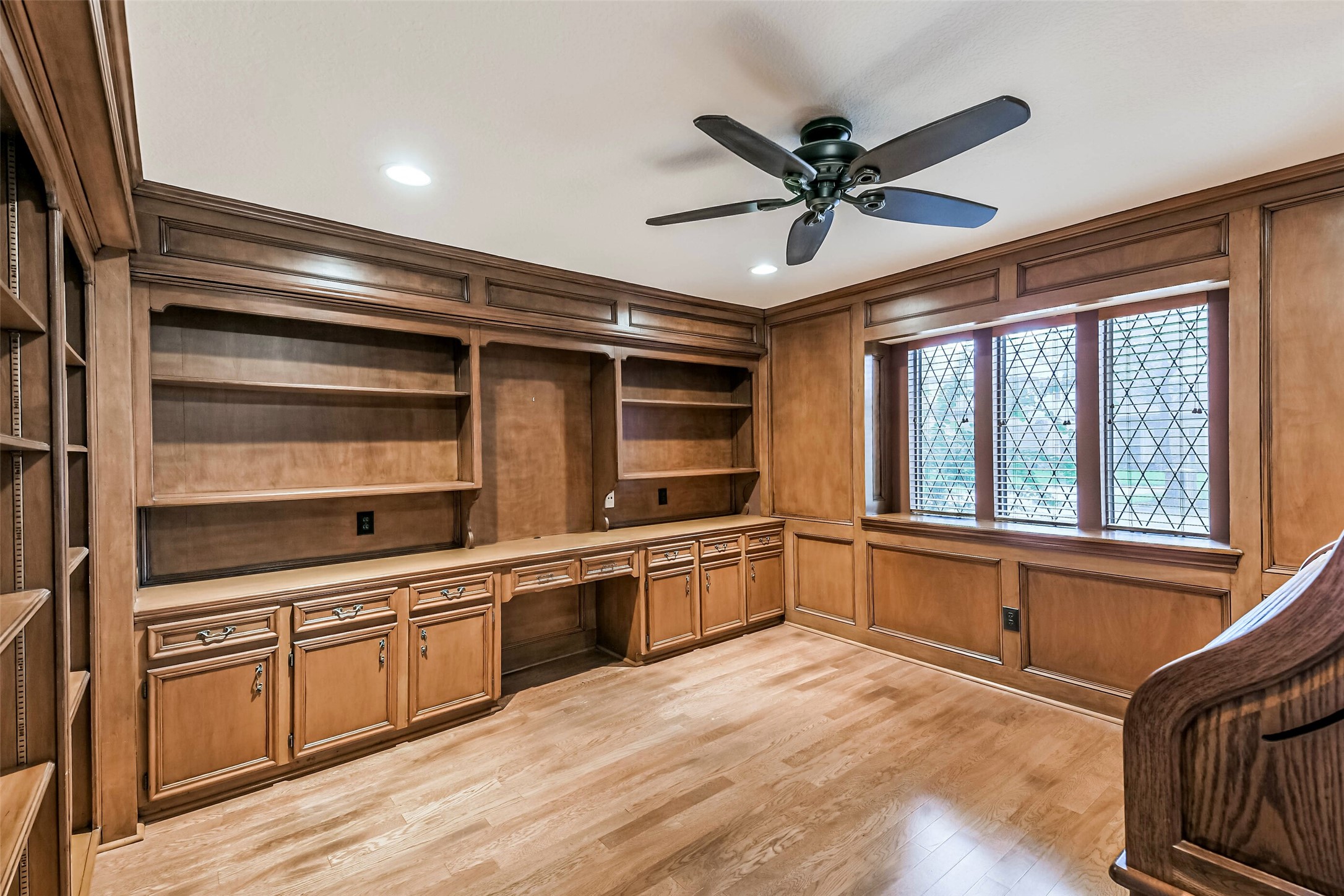 Private office/study with beautiful custom wood paneling.