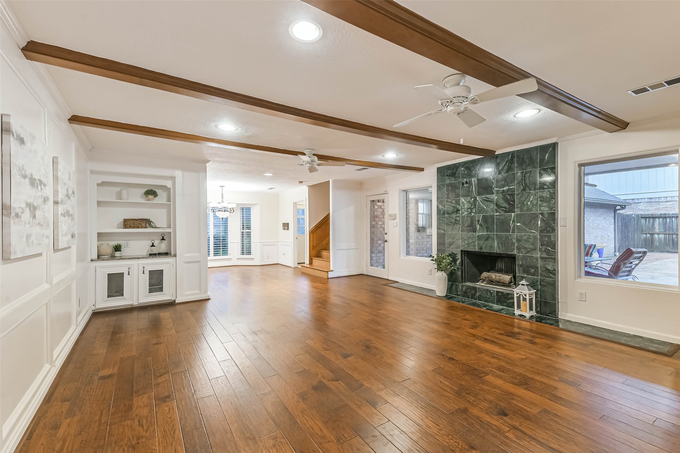 Spacious open living room with views out to the pool. Spacious open living room with views out to the pool.