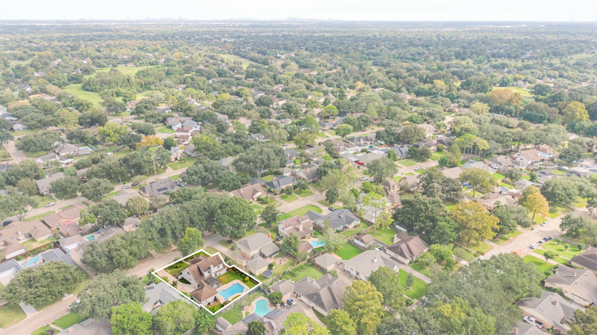 Aerial view highlighting the surrounding residential community.