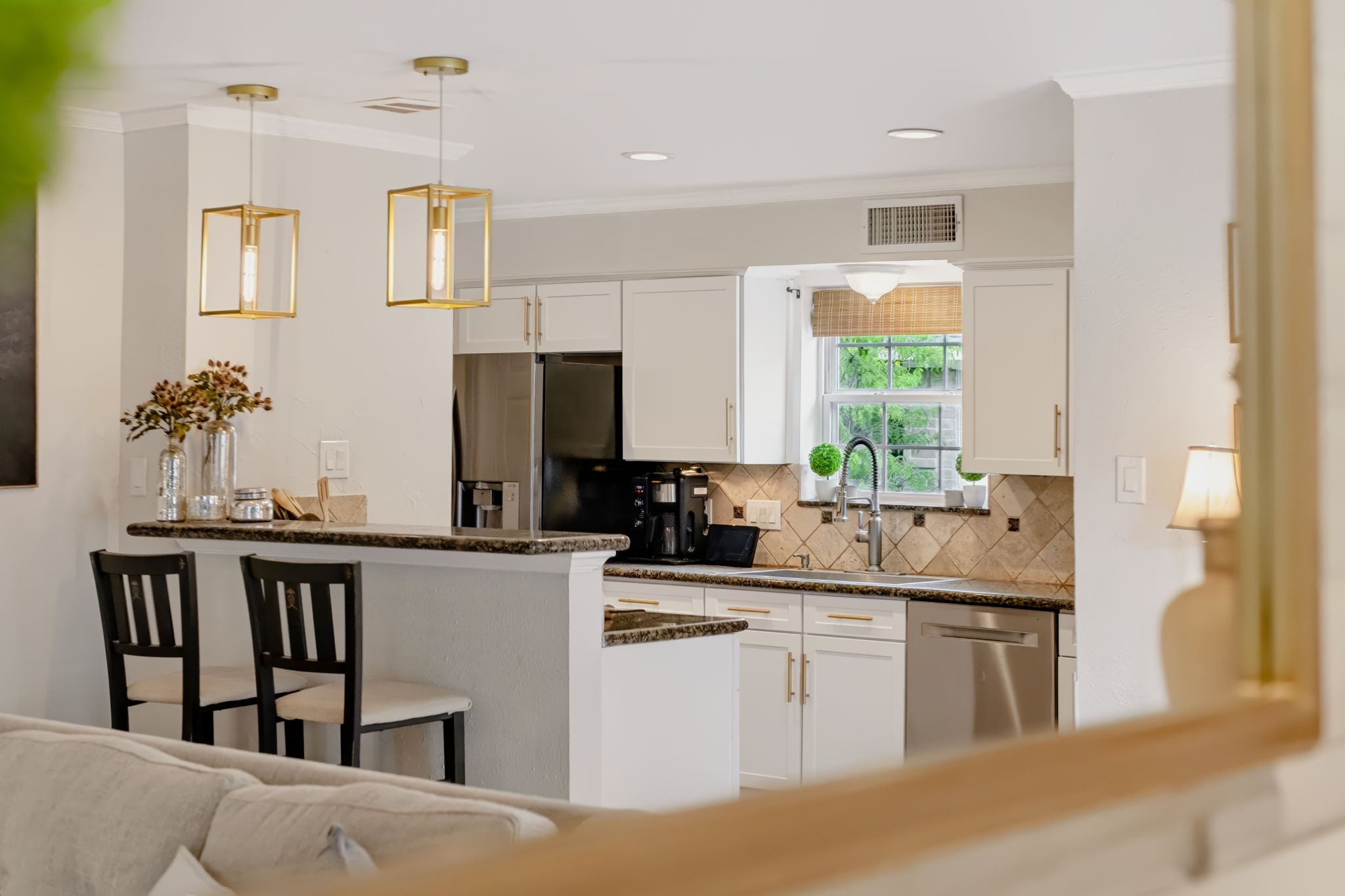 Bright kitchen with a convenient breakfast bar and generous cabinetry.