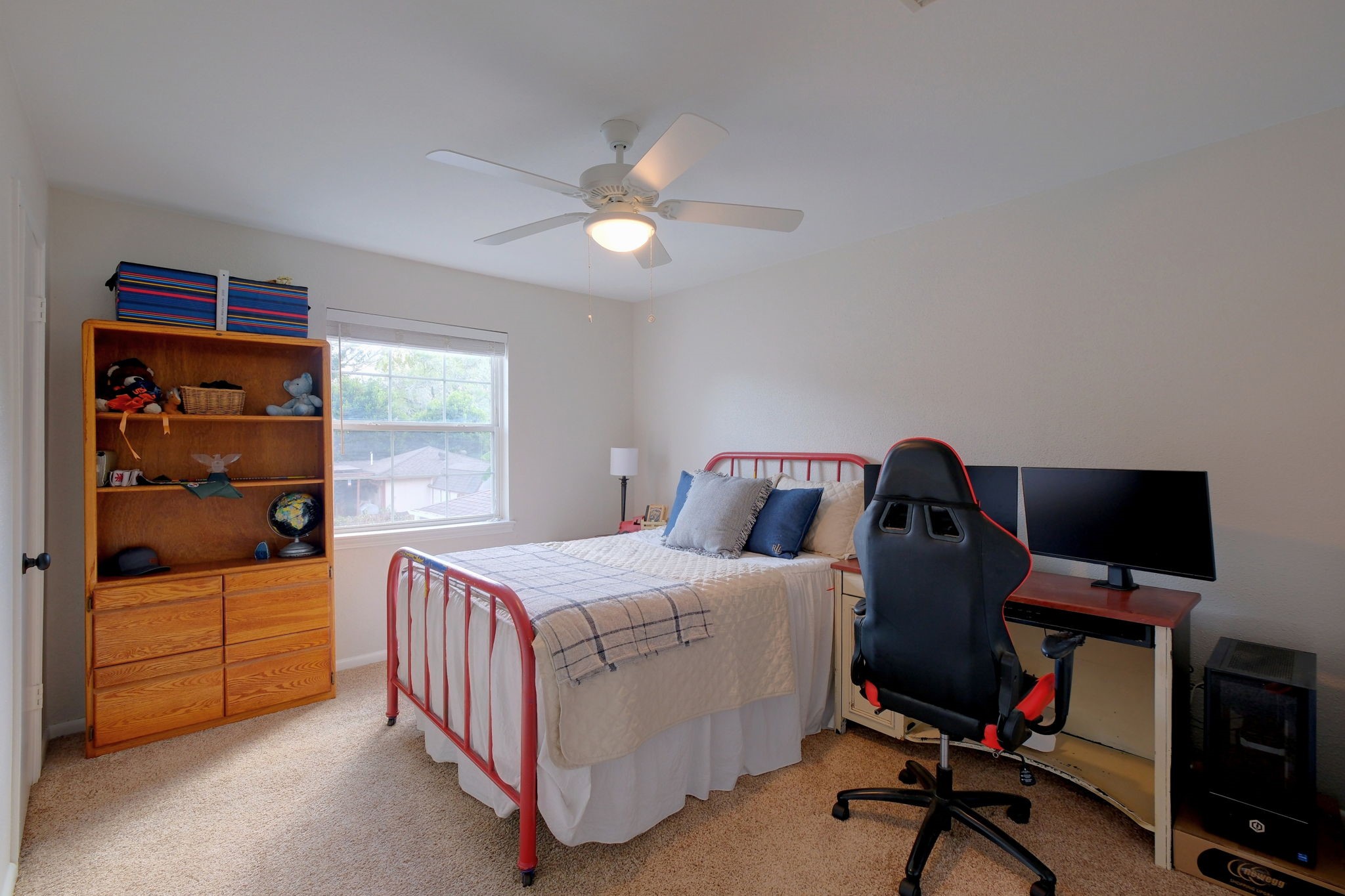 Bright secondary bedroom with natural light and new LED lighting.