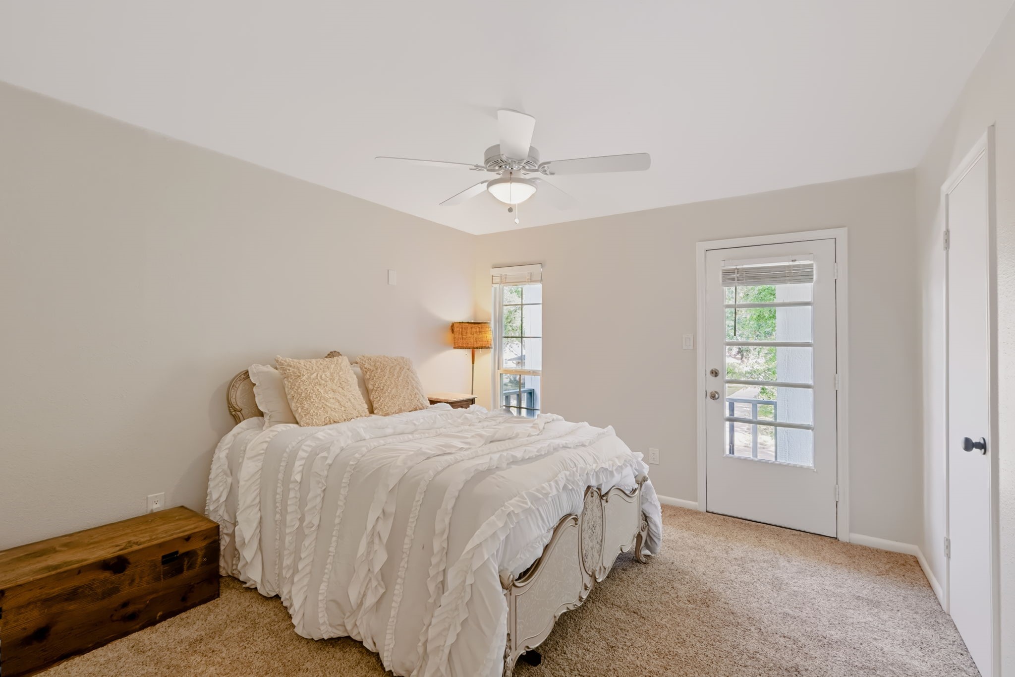 Spacious secondary bedroom featuring direct outdoor access.