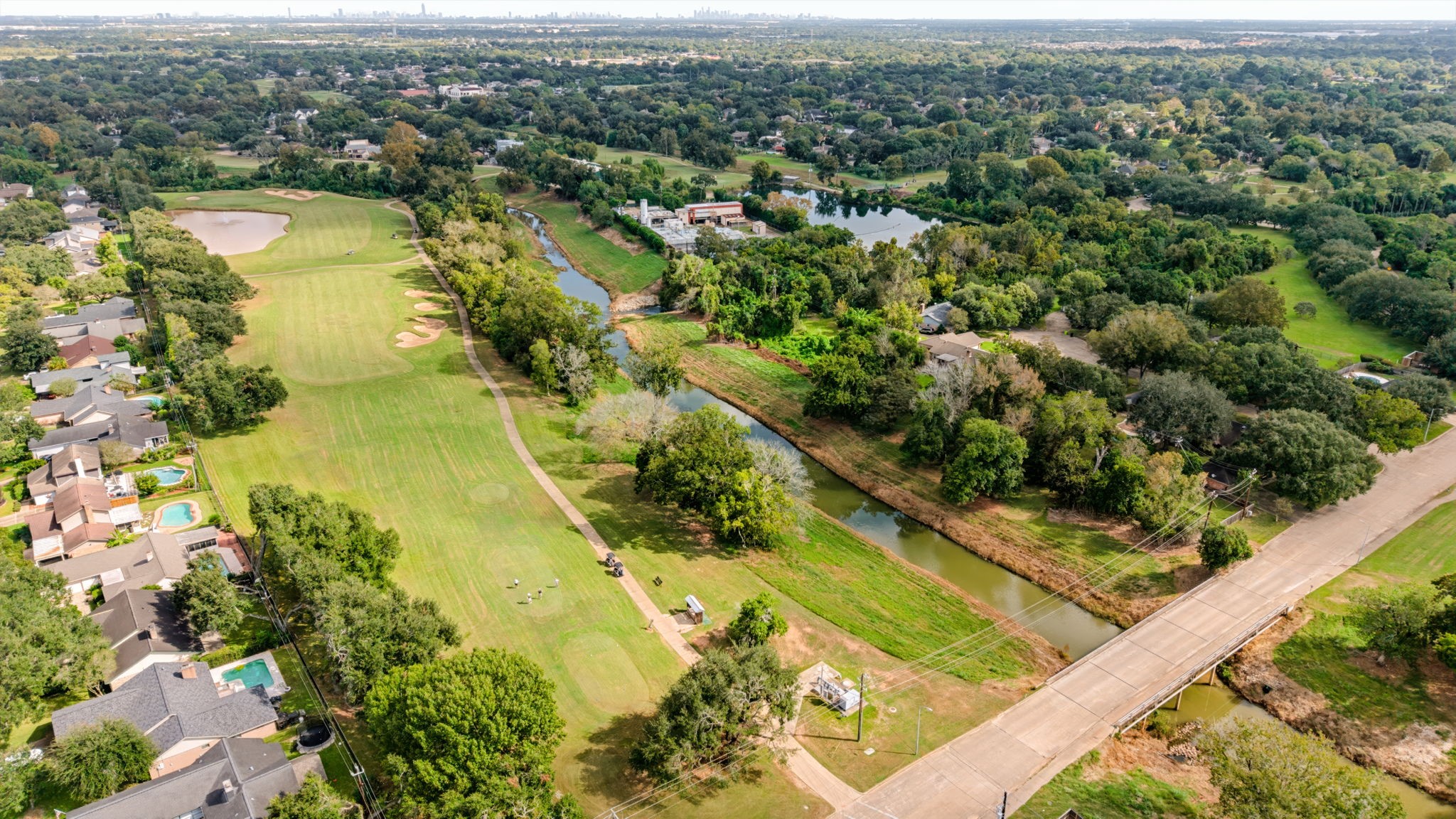 Aerial view showcasing the propertys convenient location near expansive green space.