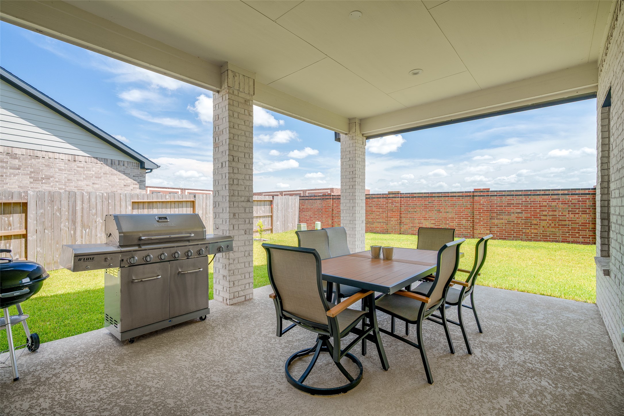 The backyard features an upgraded covered patio, perfect for outdoor relaxation and entertaining.
