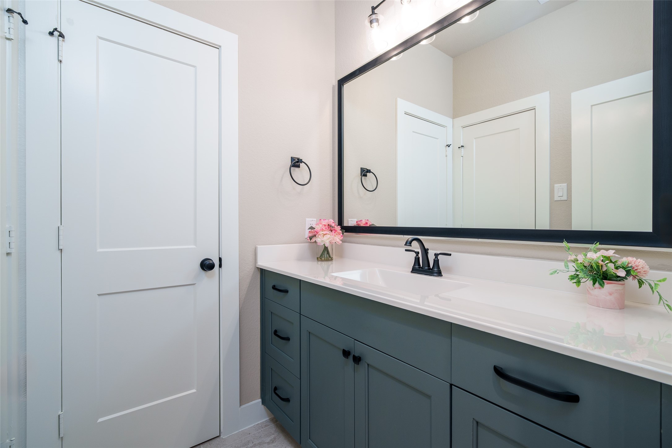 This convenient guest feature includes a private sink with easy access to a shared bathroom, offering both comfort and privacy for visitors.