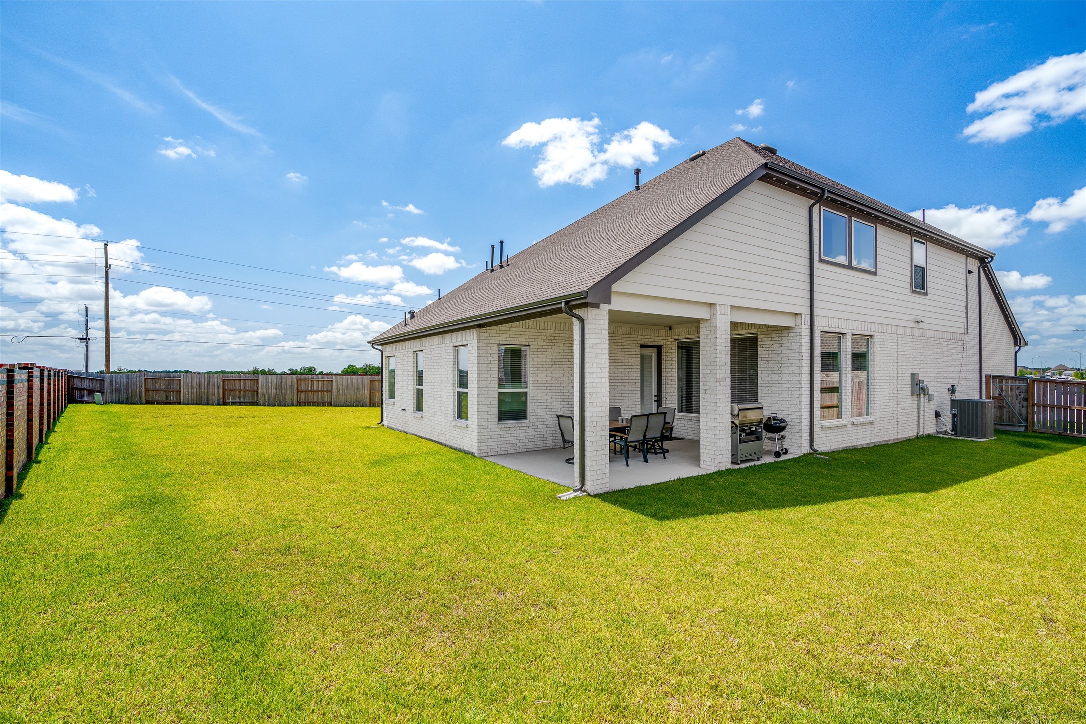 Step into your private outdoor retreat .This oversized backyard boasts a spacious covered patio and a lush lawn, all enclosed by a privacy fence for the perfect blend of comfort and seclusion.