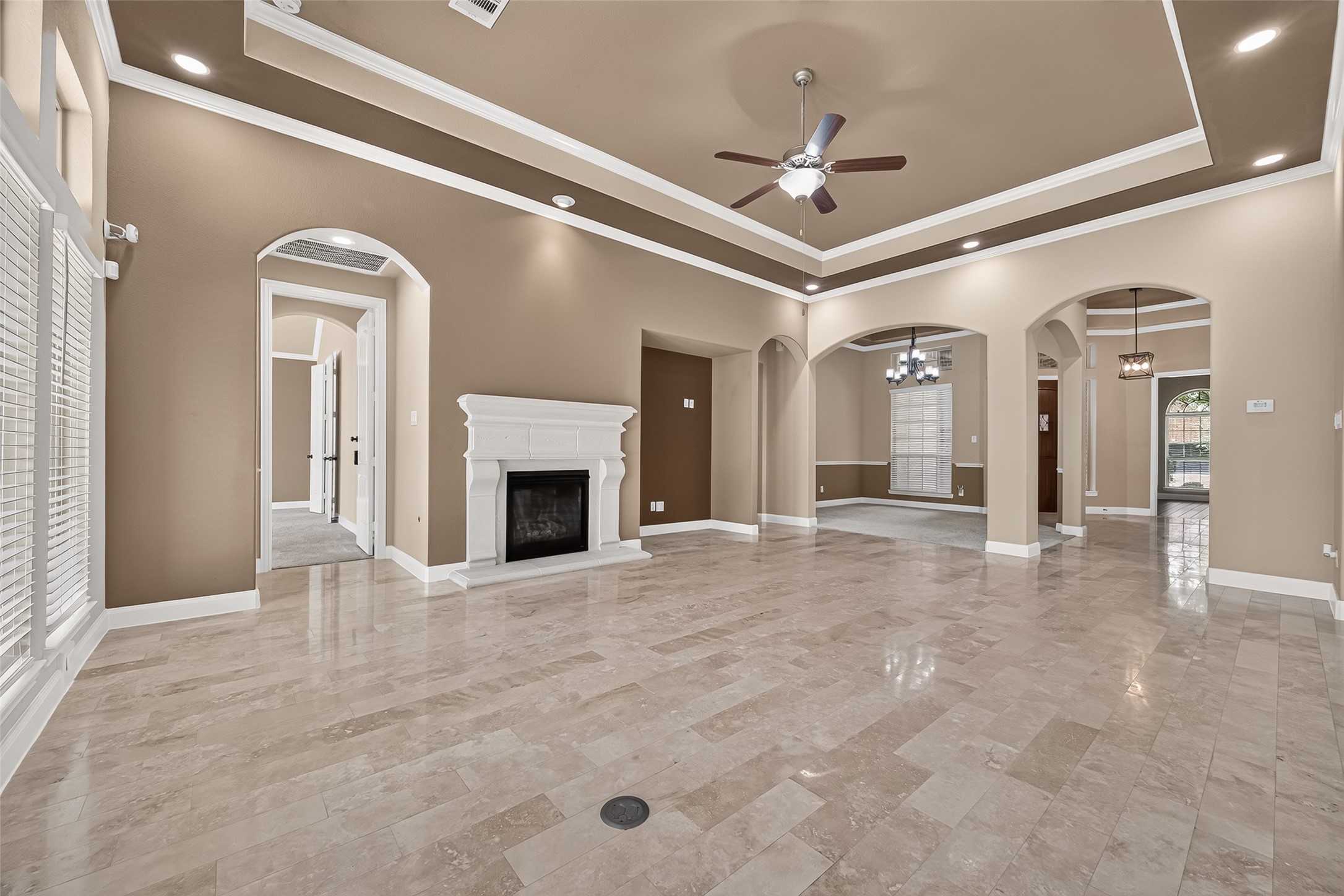 Inside the main home, you'll find elegant architectural arches, high ceilings, abundant recessed lighting, and durable Travertine flooring throughout the main living areas. Inside the main home, you'll find elegant architectural arches, high ceilings, abundant recessed lighting, and durable Travertine flooring throughout the main living areas.