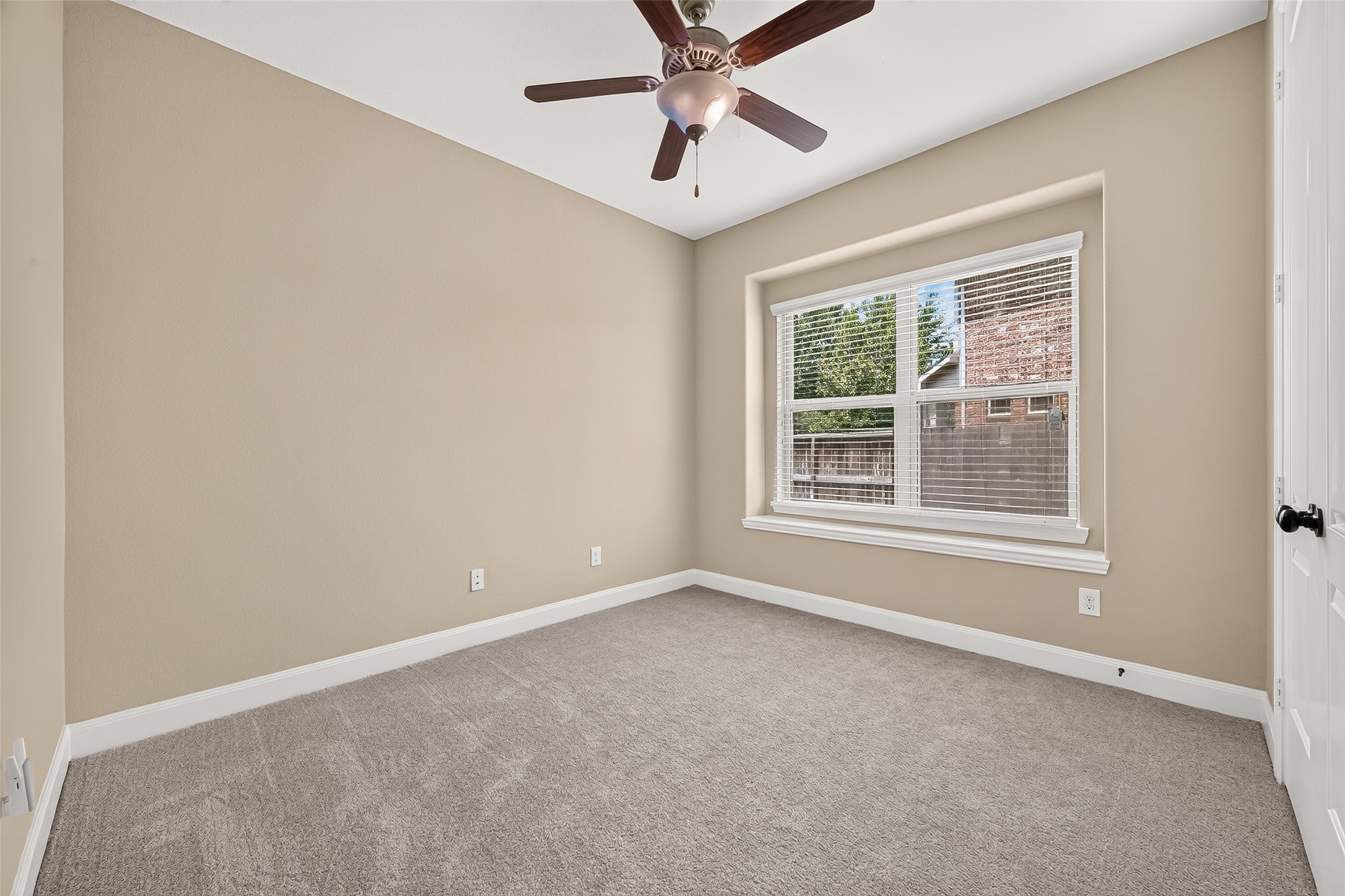 Downstairs Bedroom: A secondary bedroom is conveniently located on the first floor, including a nearby full bathroom with a walk-in shower.