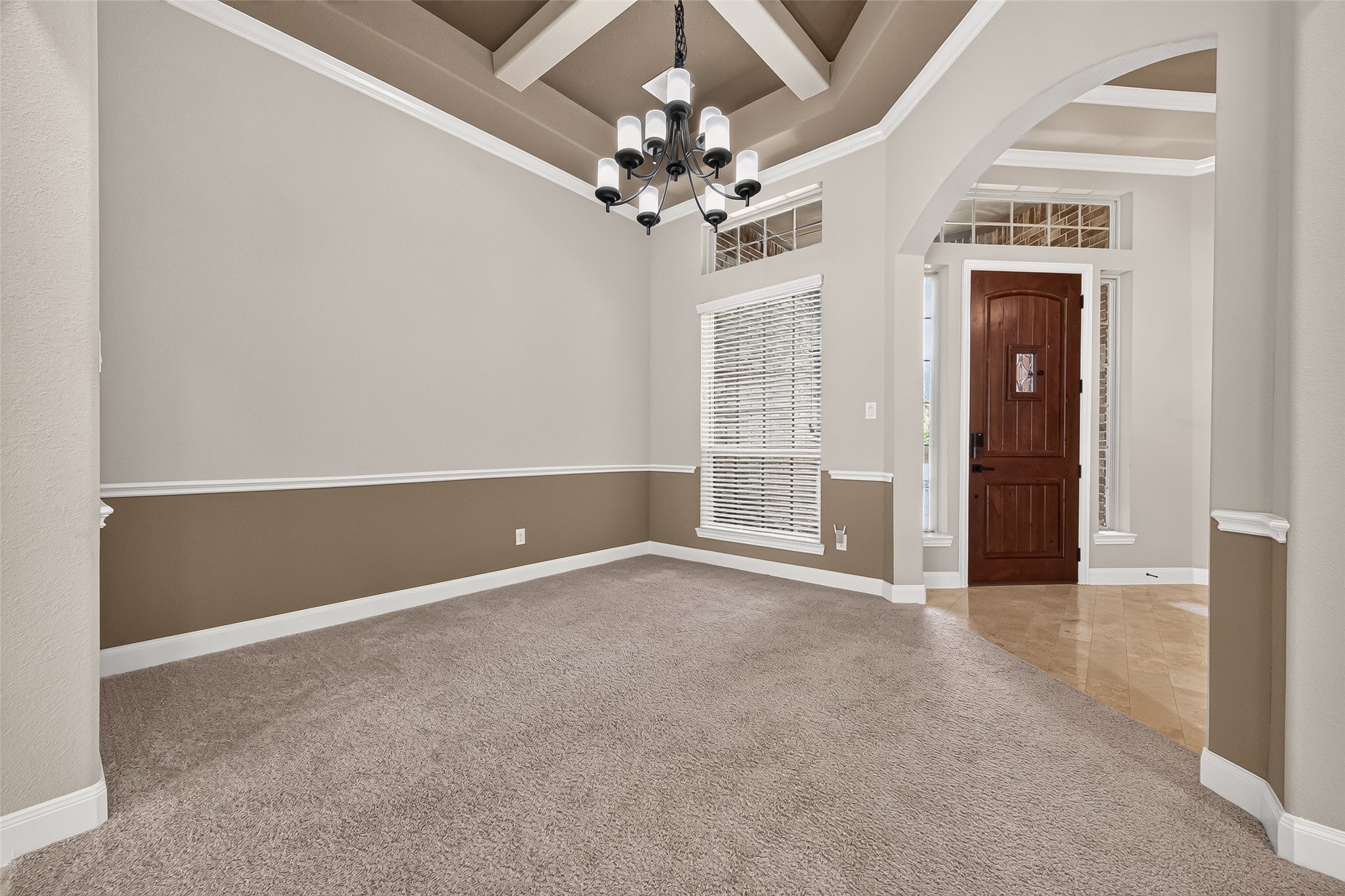 Formal Dining: The formal dining room features an impressive coffered ceiling, plush carpet and view from every corner. Formal Dining: The formal dining room features an impressive coffered ceiling, plush carpet and view from every corner.