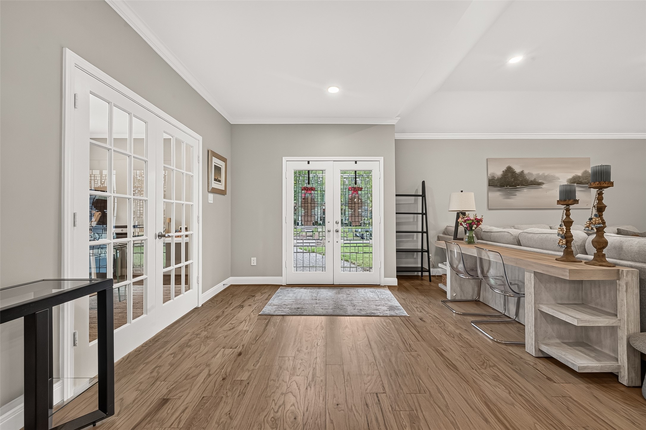 Entry of the home. French doors to the left lead to a study and to the right is the living room.