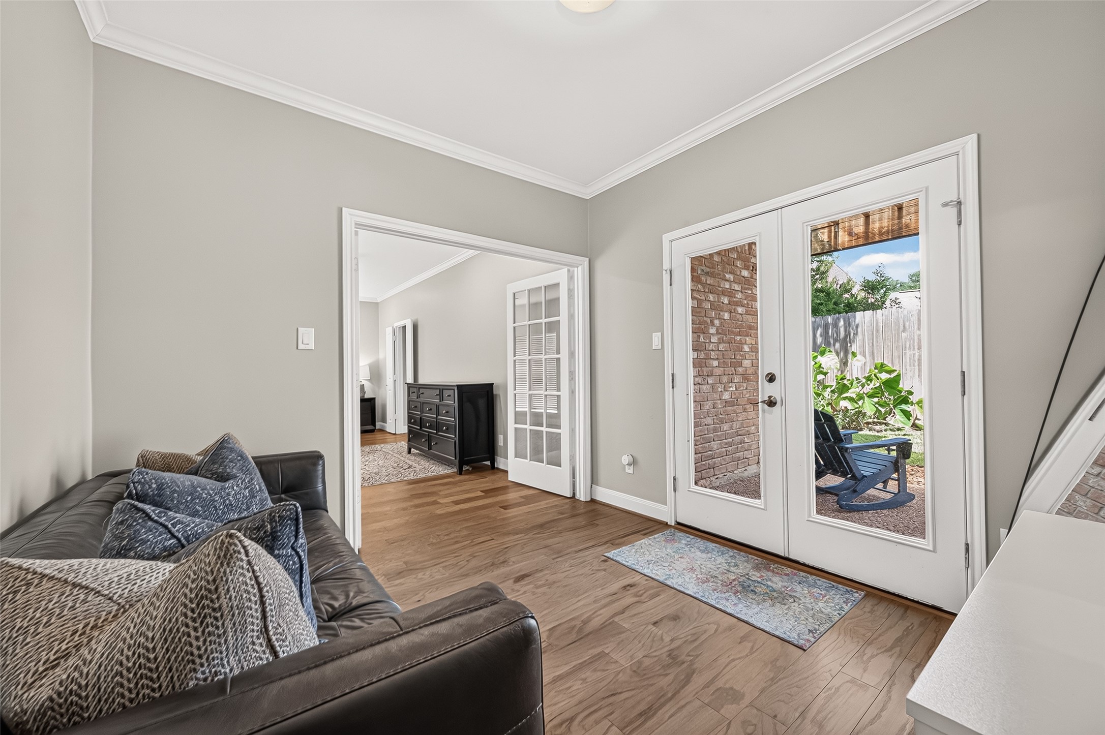 Another view of this flex room off the primary bedroom. The French doors lead to a patio and backyard.