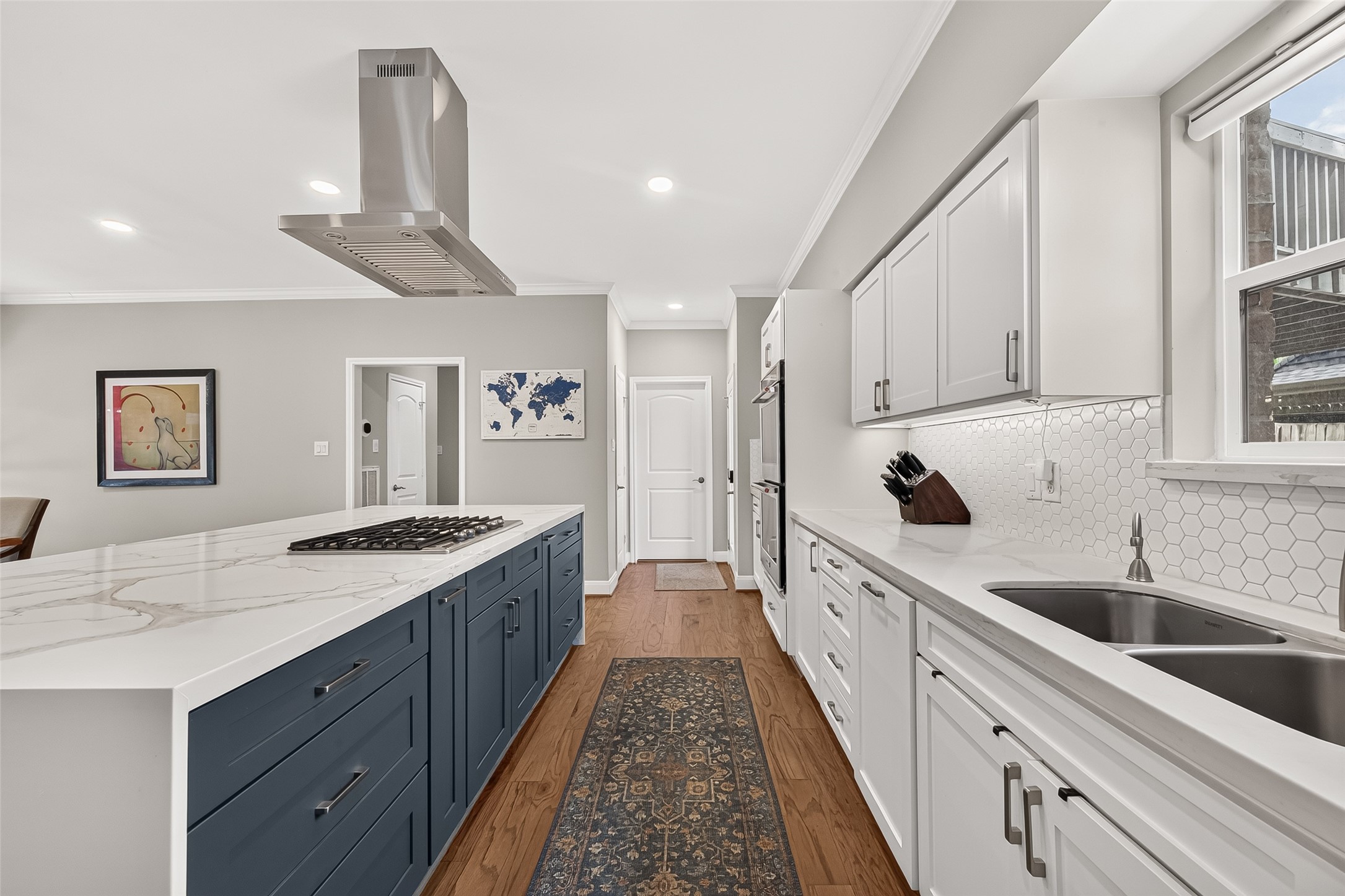 The door in the background leads to the large laundry room and one of 2 pantries.