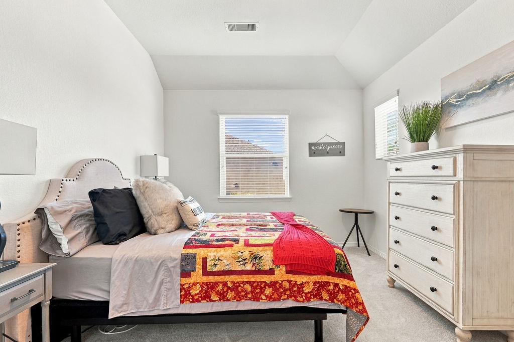 Bedroom 2- Upstairs w/ walk-in closet and attic access door.
