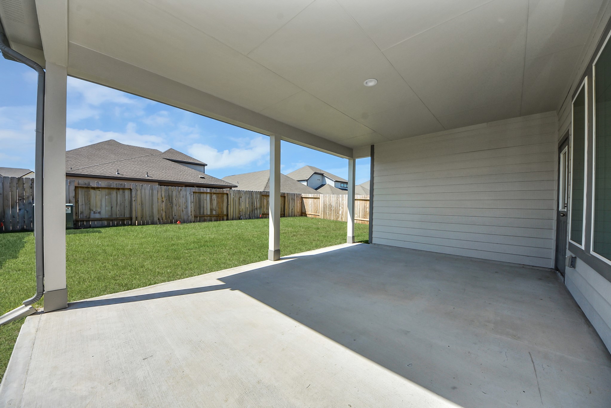 Come and see this spacious backyard with its beautiful covered patio. There is plenty of room for the kids to play and adults to relax. Perfect for your outdoor living space, patio furniture, bbq pit, and so much more. The possibilities are endless!