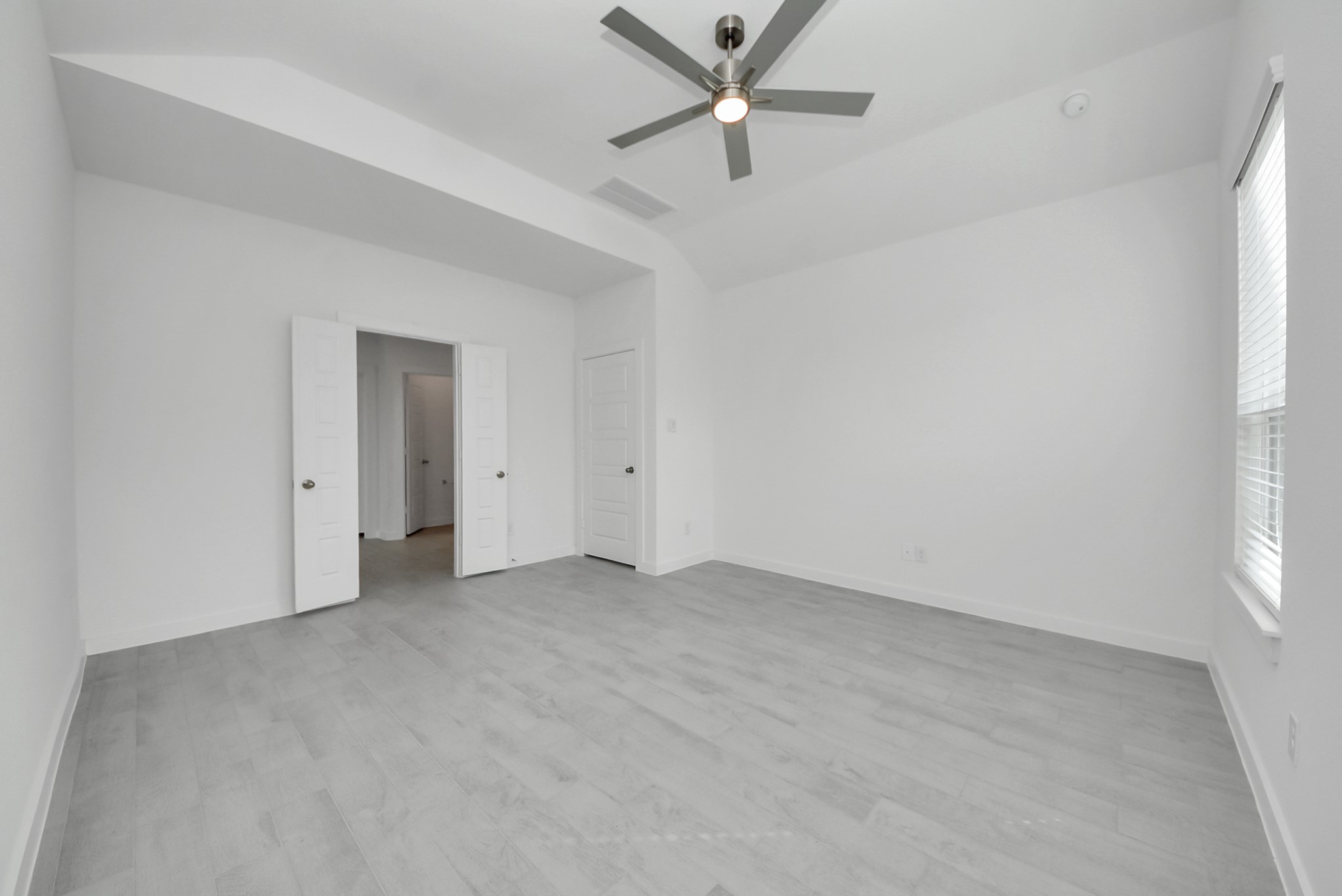 Escape to tranquility in this spacious primary room.