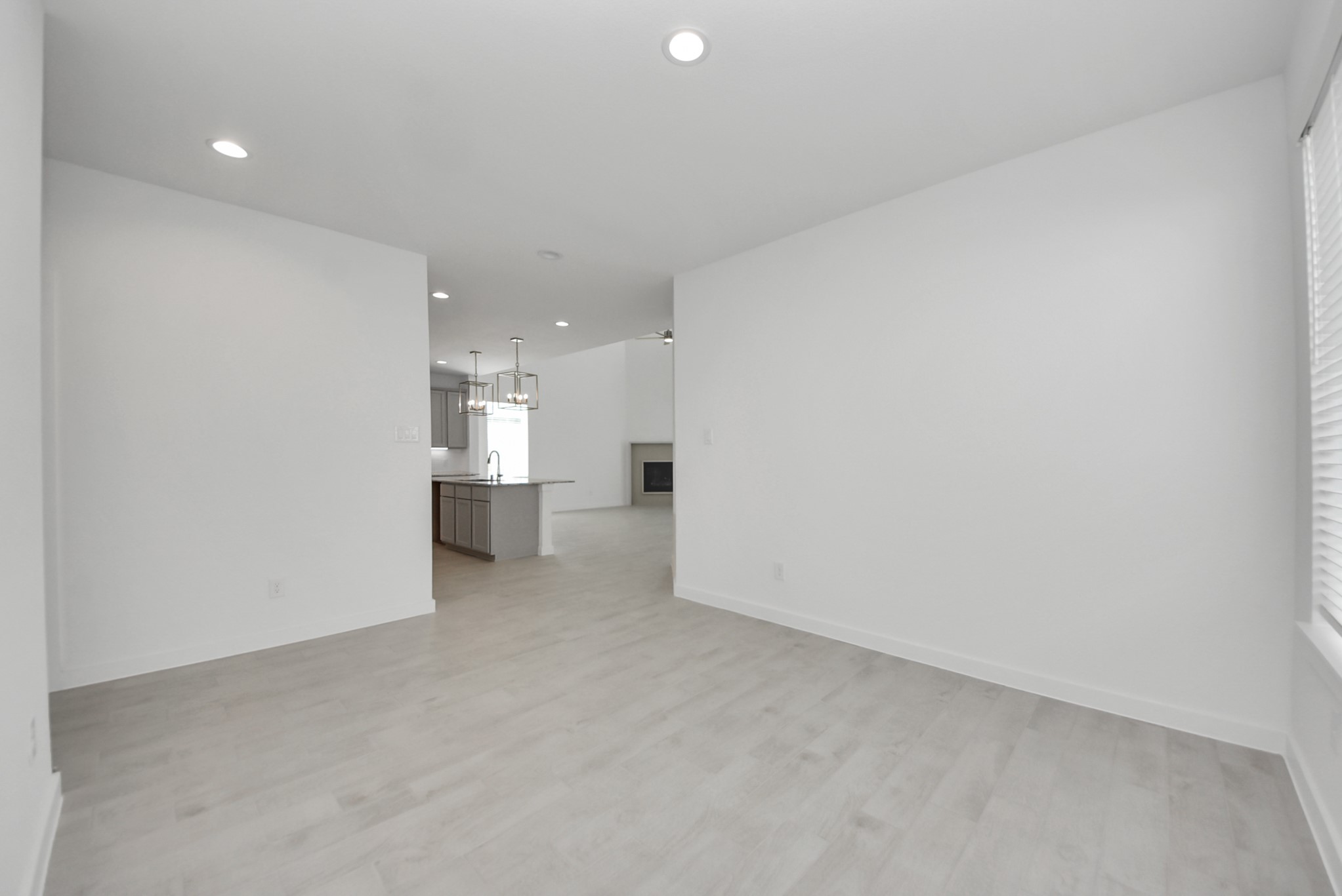 Make memories gathered around the table with your family and friends! This spacious dining room features elegant flooring, custom paint, and adjacent to family room and kitchen for open concept feel.