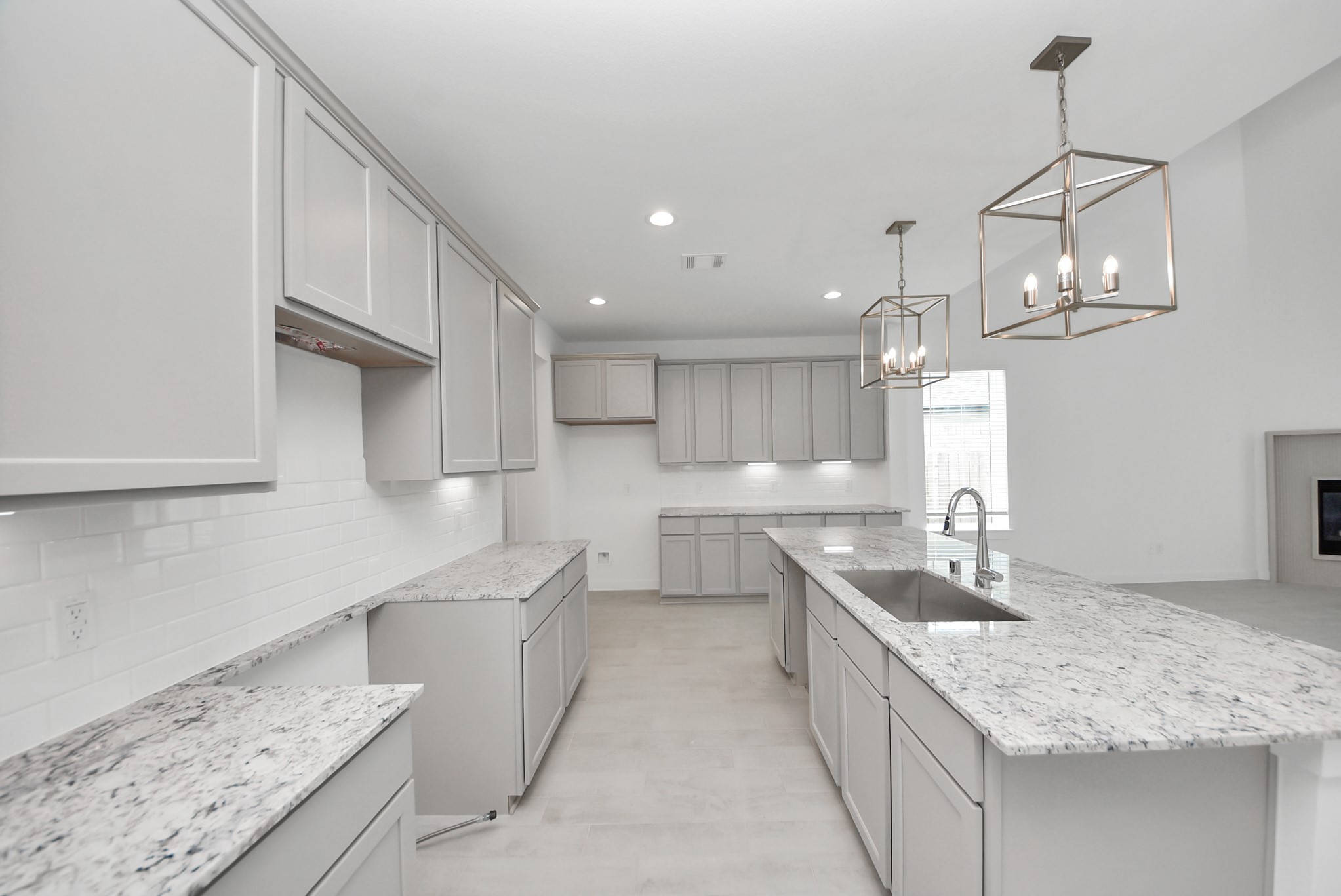 All of this overlooks your expansive family room, creating a perfect space for culinary delights and family gatherings.
