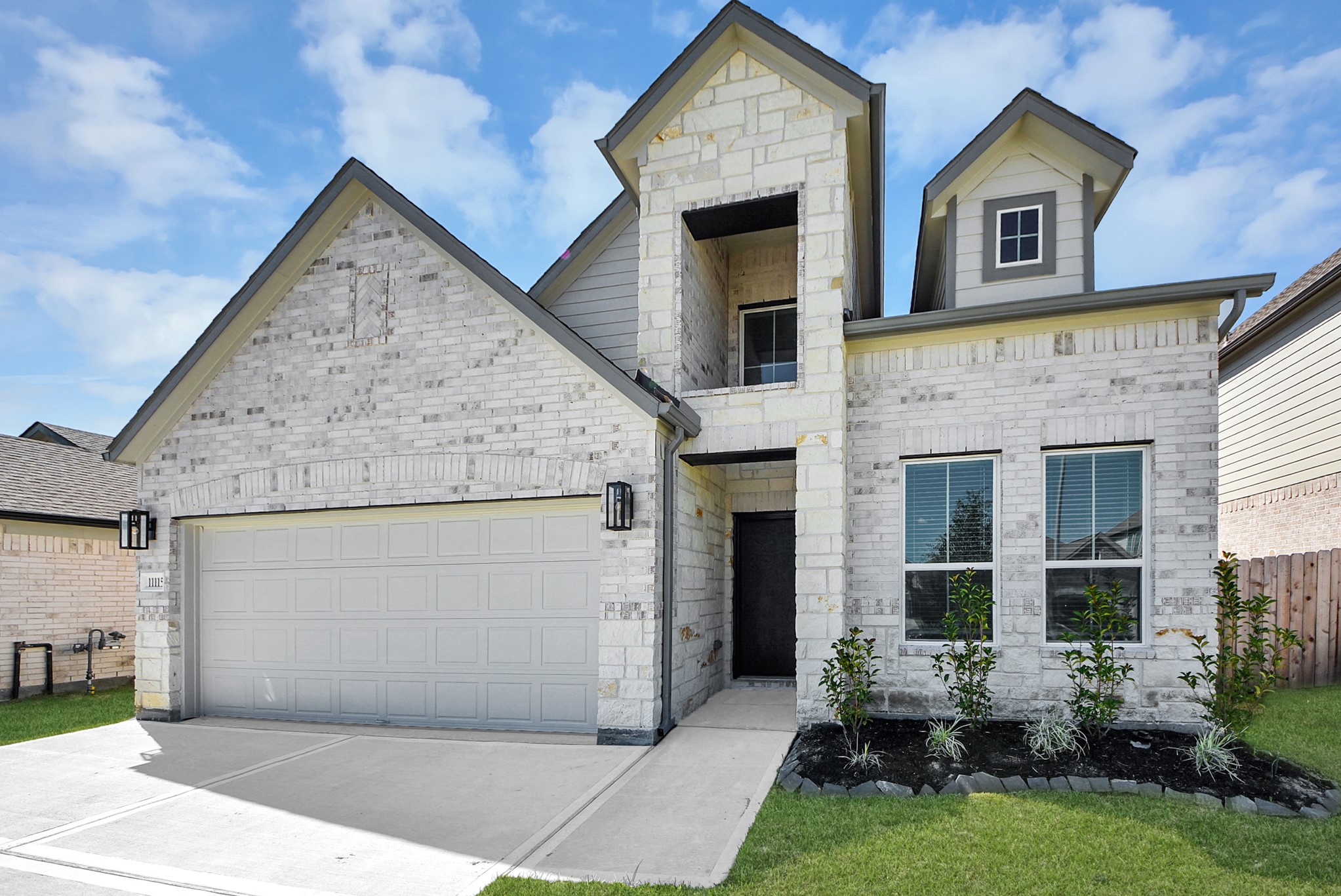 Home features a convenient 2-car garage complemented by a spacious driveway, offering ample parking for you and your guests.