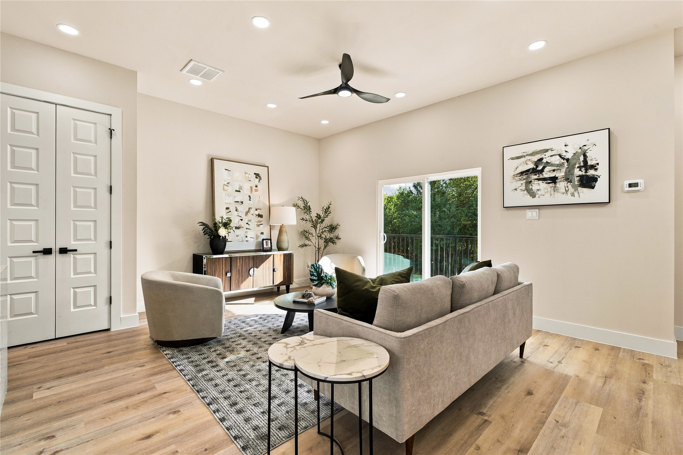 Light-filled main lounge  sunlit living room with direct balcony access designed for weekend lounging.